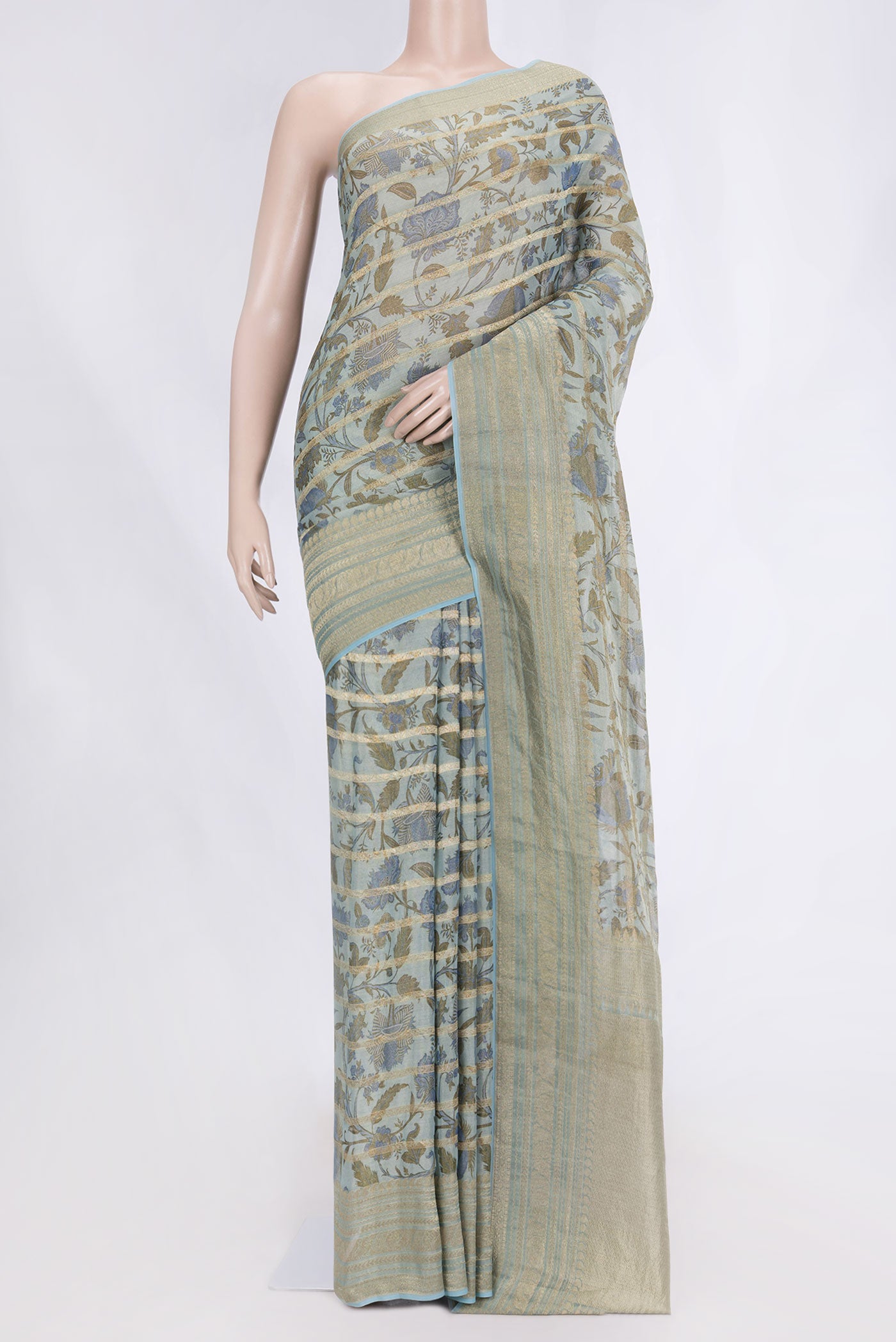 Light Blue Dual Tone Mysore Georgette Saree with Printed design on the body and Zari Border displayed on a mannequin