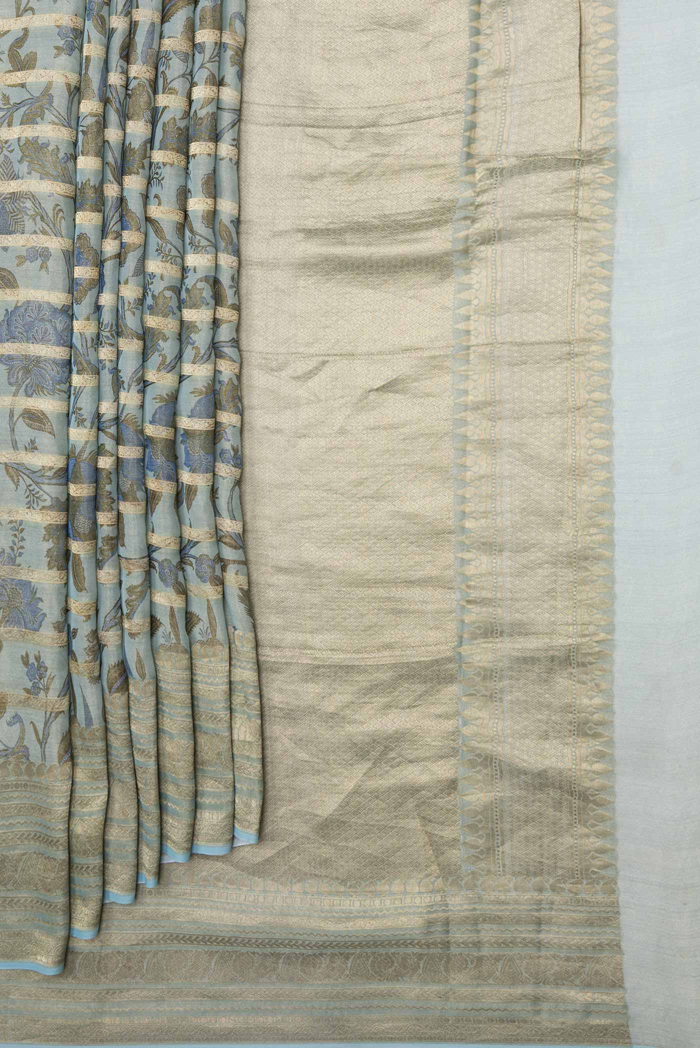 Pleats and pallu of Light Blue Dual Tone Mysore Georgette Saree with Printed design on the body and Zari Border