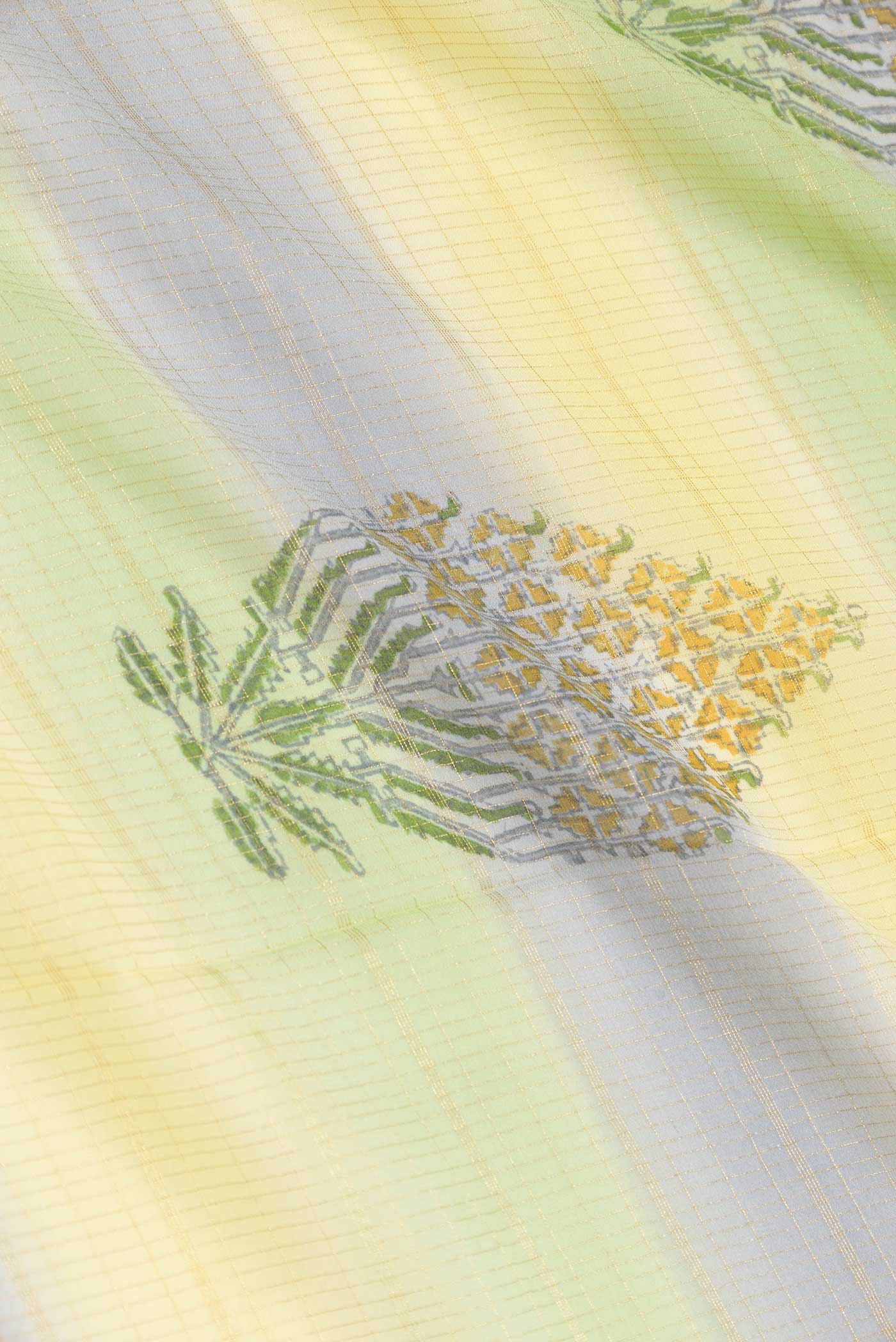 Close up of Green, Yellow and Lavender Color Mysore Georgette Saree with Checked design on the body and Zari Border displaying folds