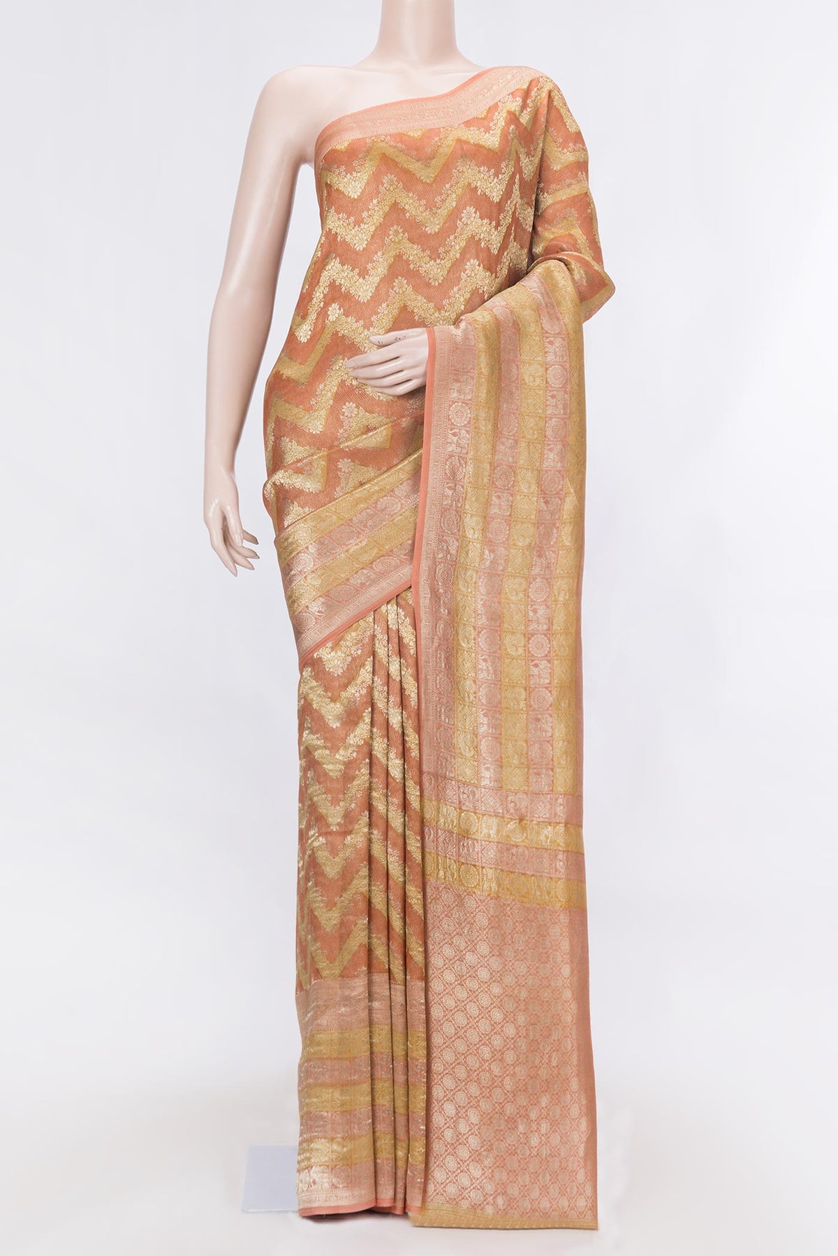 Golden Peach Dual Tone Mysore Georgette Saree with Zari Butta on the body and Zari Border displayed on a mannequin
