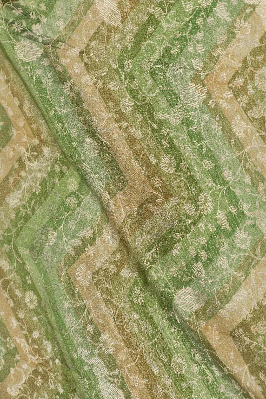 Close up of Green Mysore Crepe Saree with Zari Brocade on the body and Zari Border displaying folds