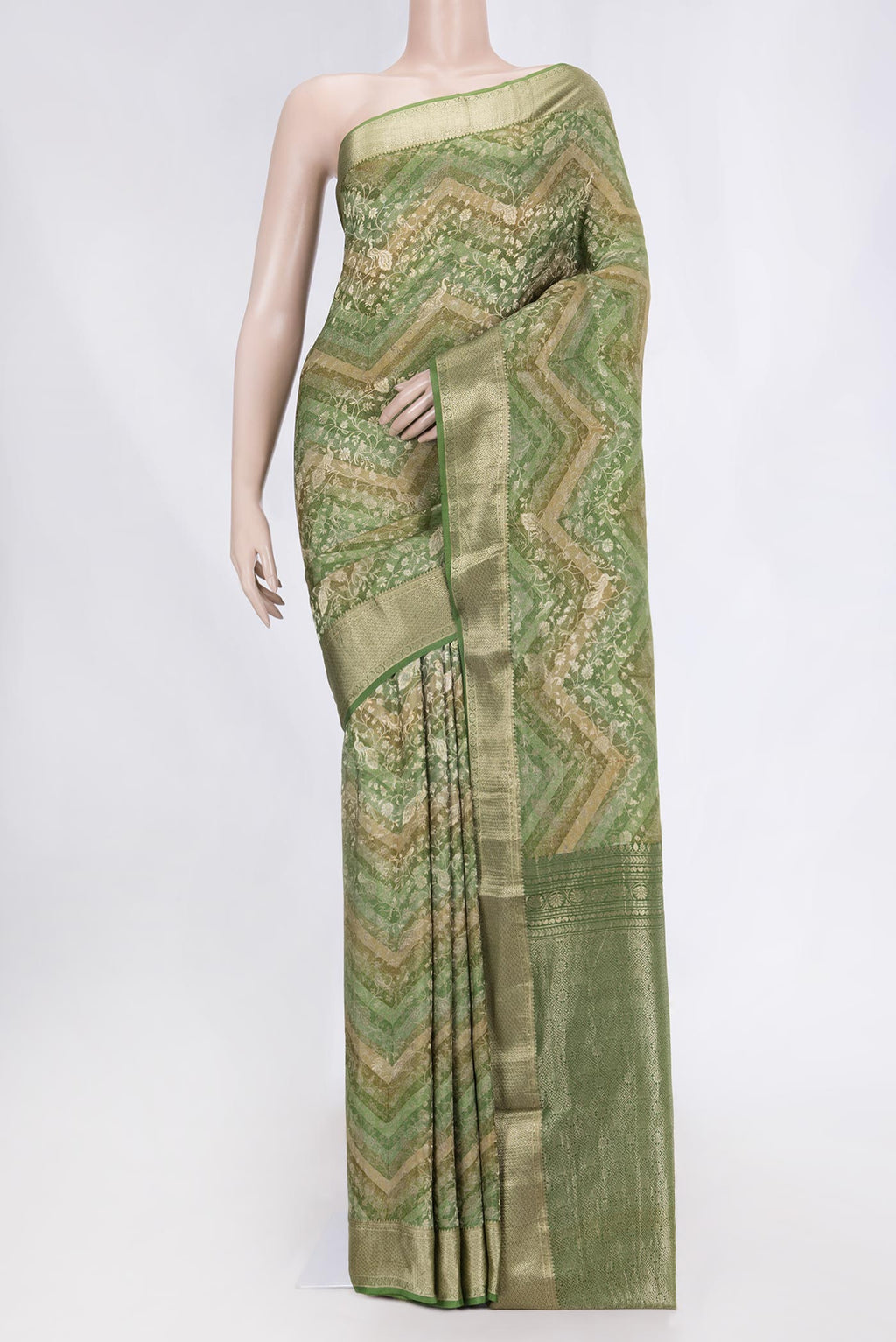 Green Mysore Crepe Saree with Zari Brocade on the body and Zari Border displayed on a mannequin