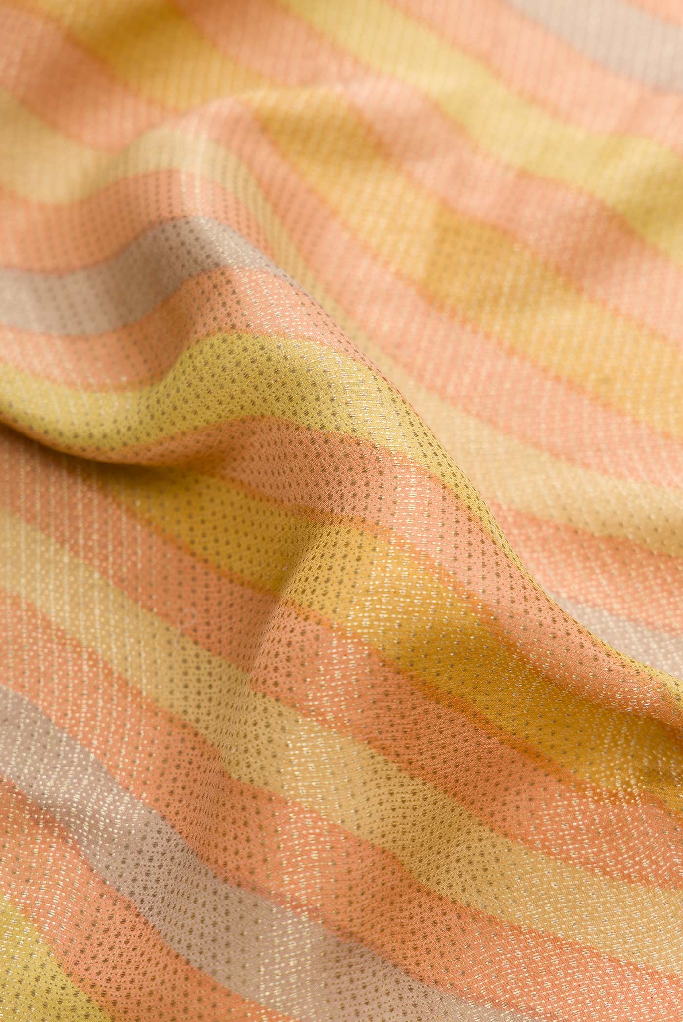 Close up of Peach, Green and Pista Green Color Banarasi Georgette Saree with Zari Brocade on the body and Zari Border.  displaying folds