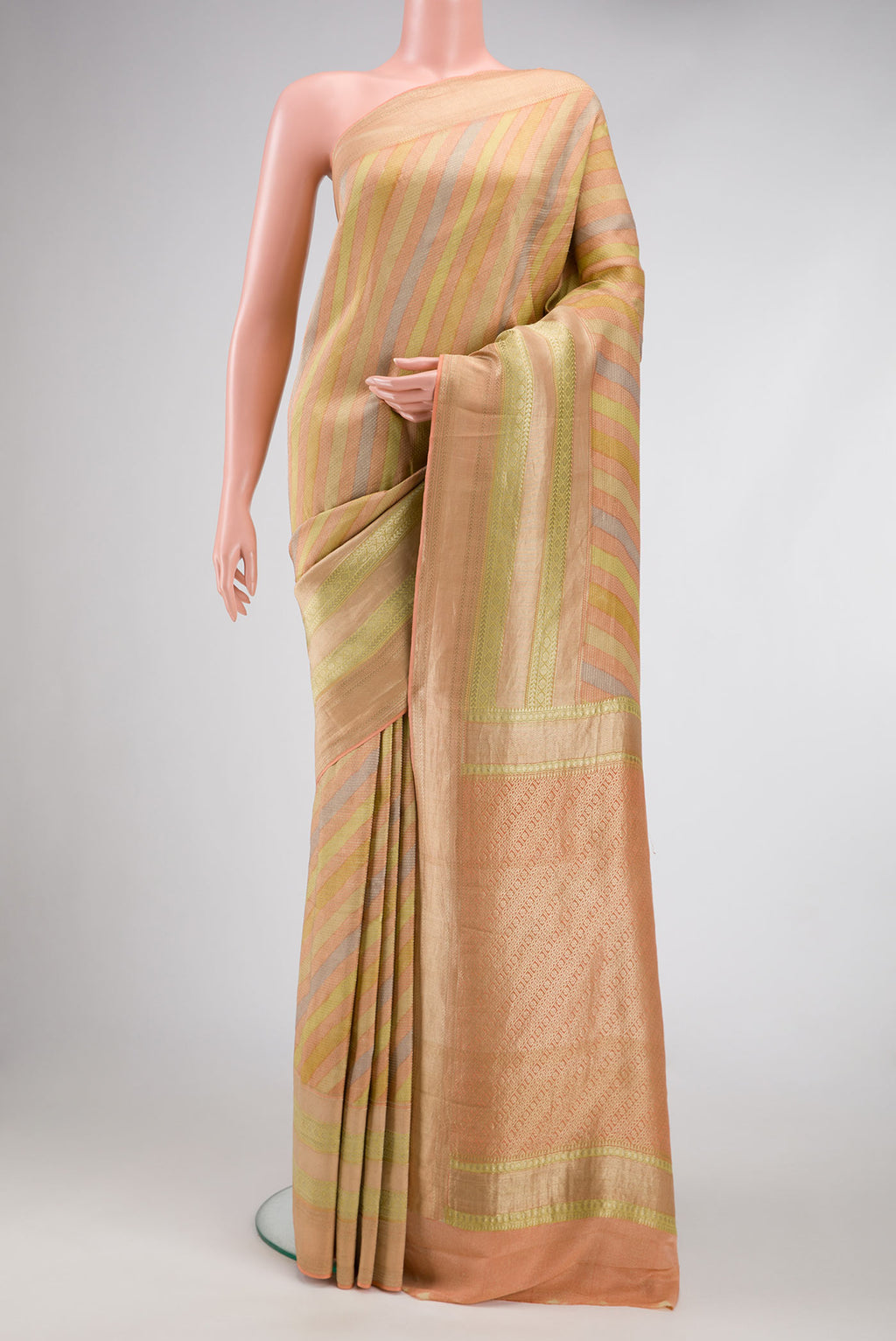 Peach, Green and Pista Green Color Banarasi Georgette Saree with Zari Brocade on the body and Zari Border.  displayed on a mannequin