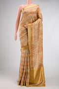 Gold Dual Tone Mysore Georgette Saree with Zari Brocade on the body and Zari Border.  displayed on a mannequin