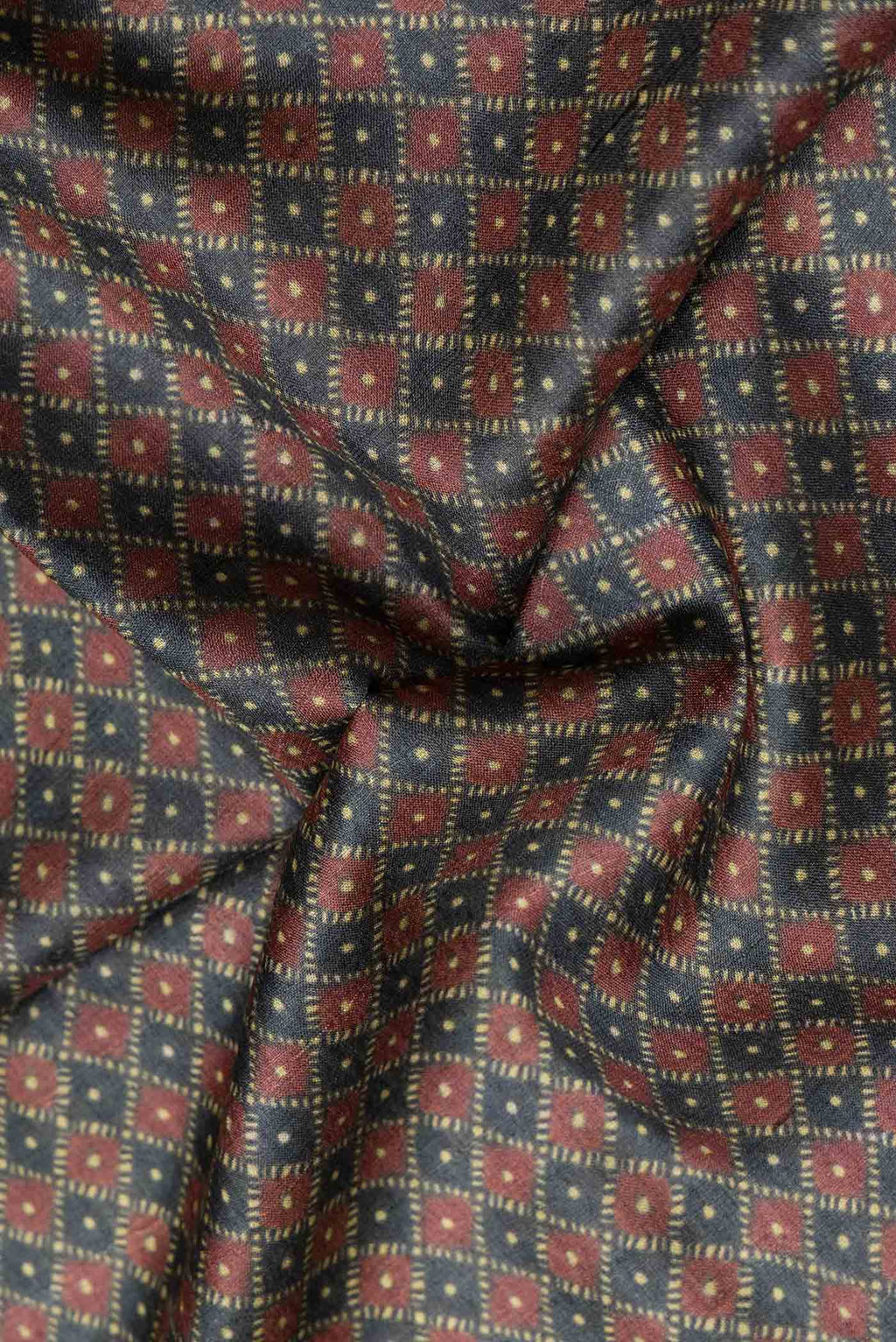Close up of Grey Dual Tone Tussar Silk Saree with Printed design on the body and Embroidery Border.  displaying folds