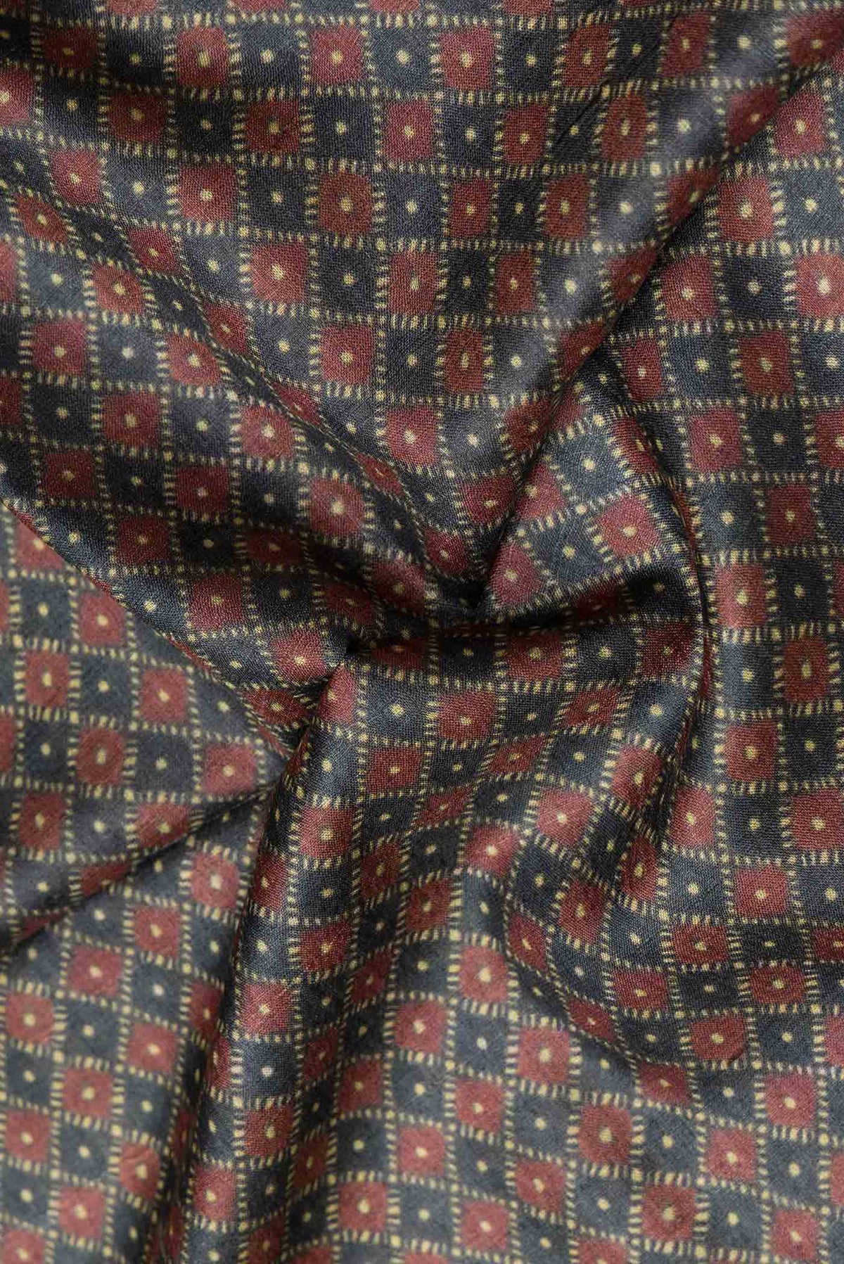 Close up of Grey Dual Tone Tussar Silk Saree with Printed design on the body and Embroidery Border.  displaying folds