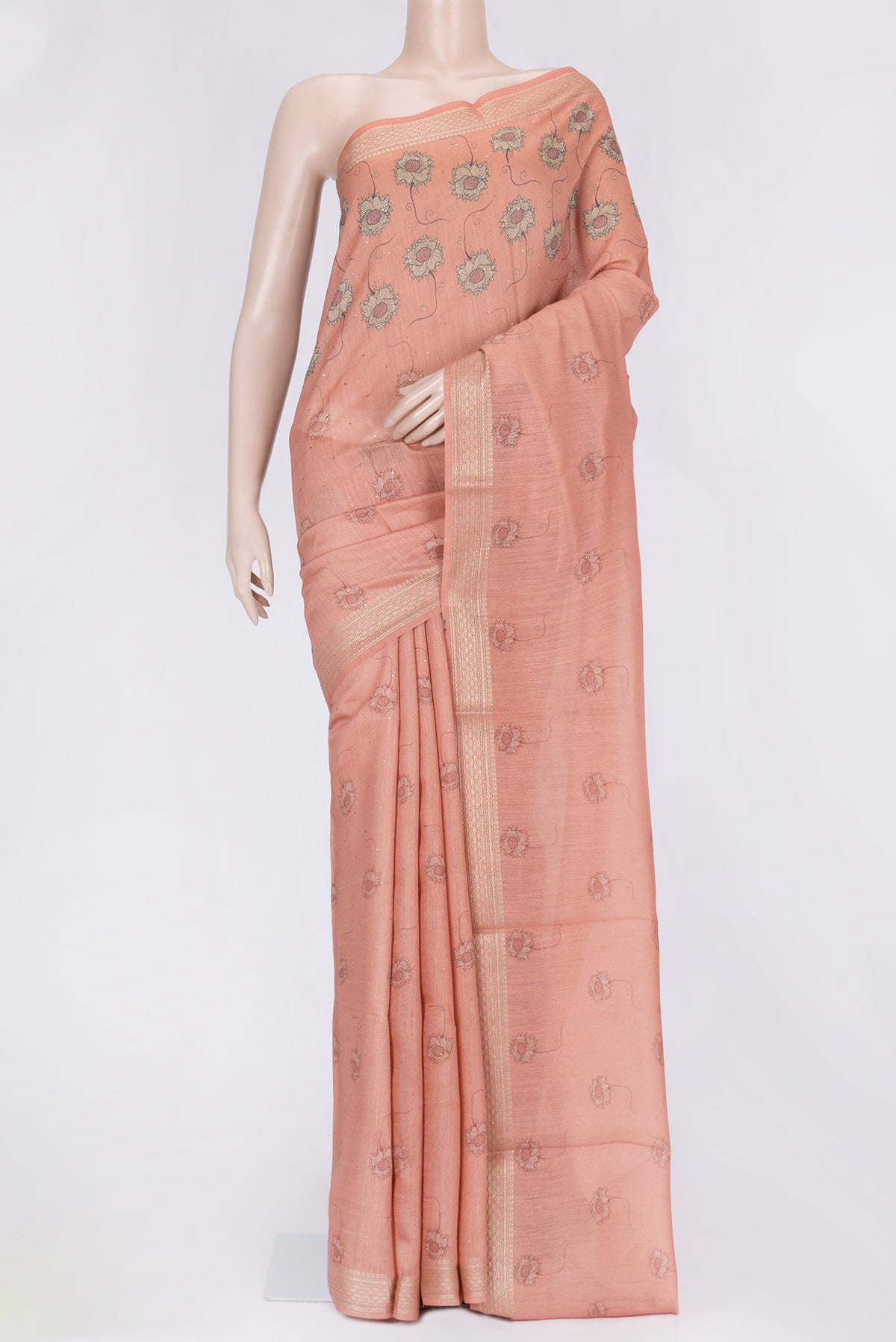 Peach Dual Tone Tussar Silk Saree with Printed design on the body and Zari Border.  displayed on a mannequin