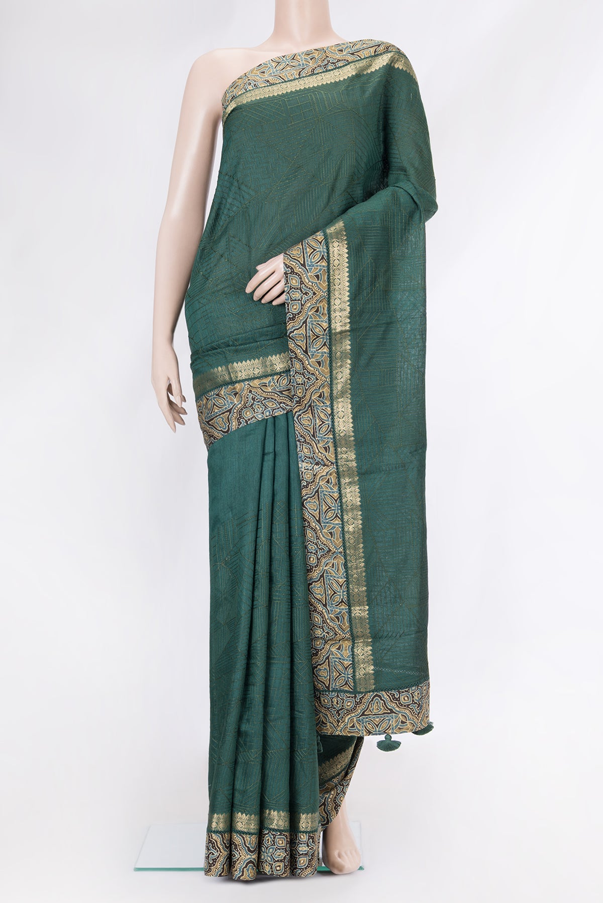 Green Dual Tone Tussar Silk Saree with Embroidery on the body and Fancy Border.  displayed on a mannequin