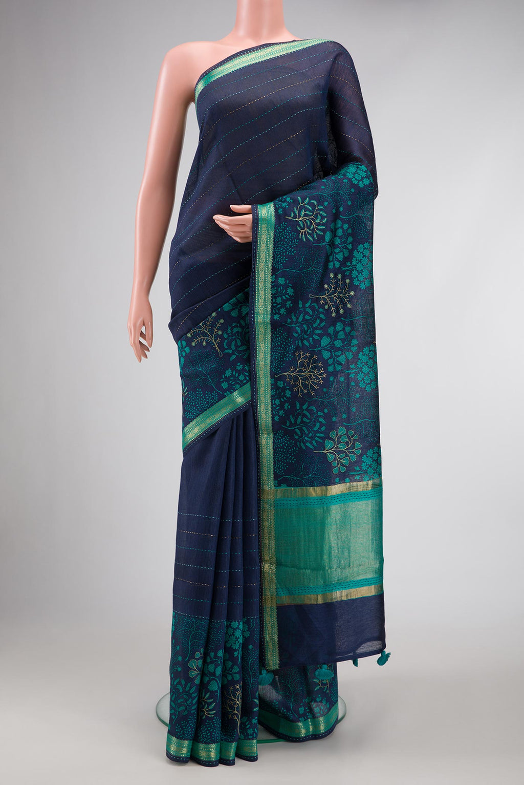 Navy Blue Dual Tone Tussar Silk Saree with Printed design on the body and Zari Border.  displayed on a mannequin