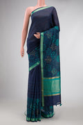 Navy Blue Dual Tone Tussar Silk Saree with Printed design on the body and Zari Border.  displayed on a mannequin