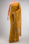 Mustard Dual Tone Tussar Silk Saree with Printed design on the body and Zari Border.  displayed on a mannequin