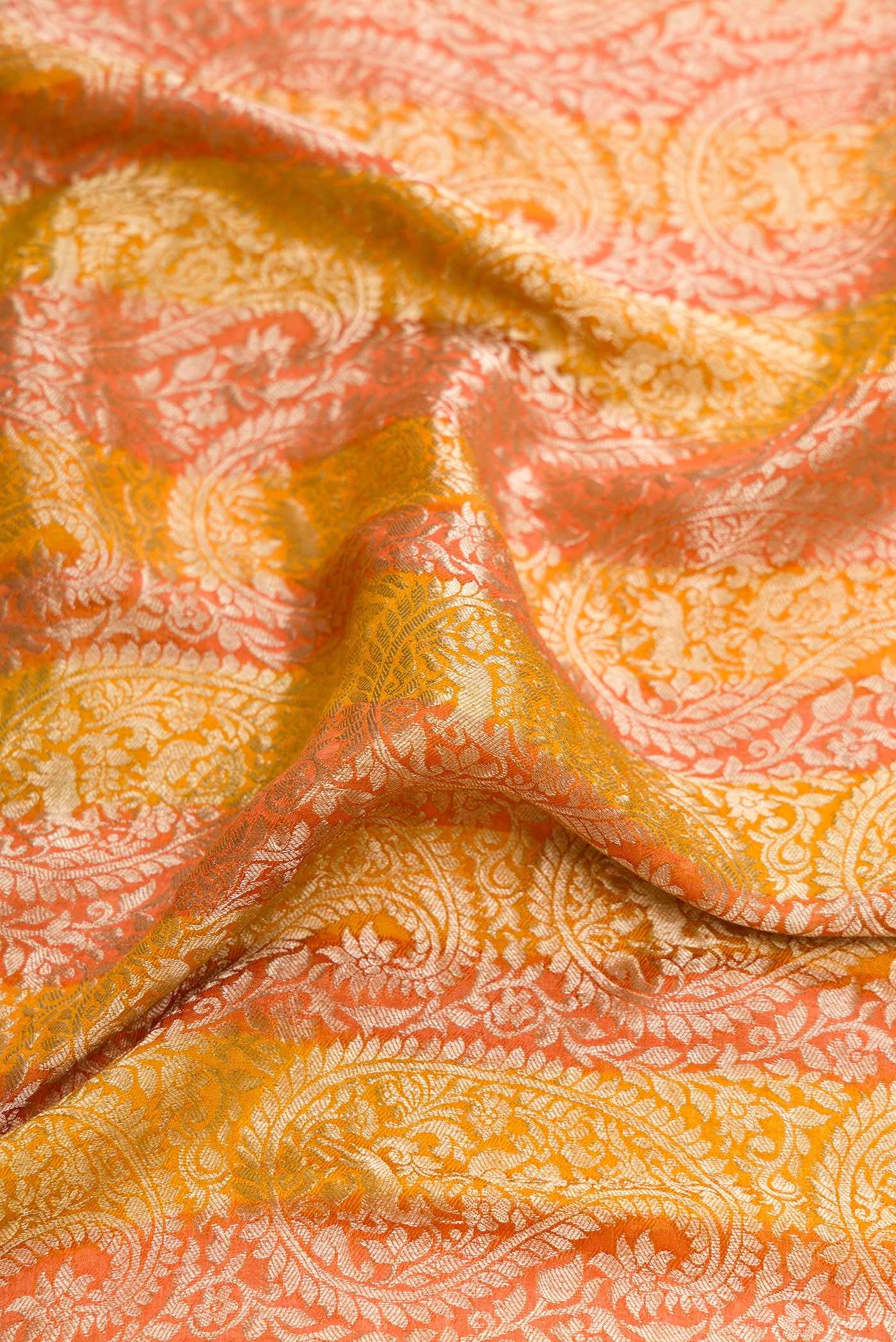 Close up of Mustard Dual Tone Tussar Silk Saree with Zari Brocade on the body and Zari Border.  displaying folds