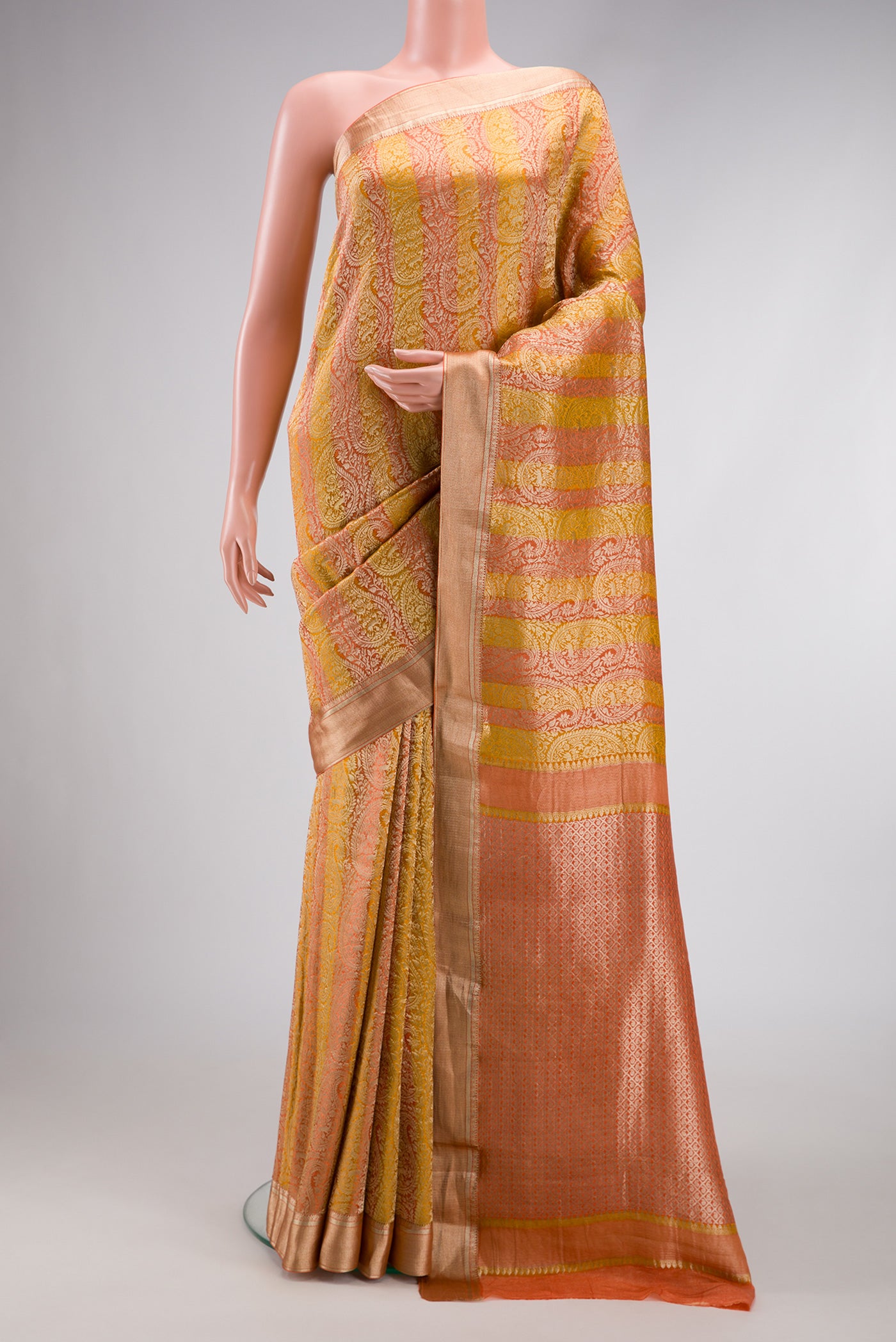 Mustard Dual Tone Tussar Silk Saree with Zari Brocade on the body and Zari Border.  displayed on a mannequin