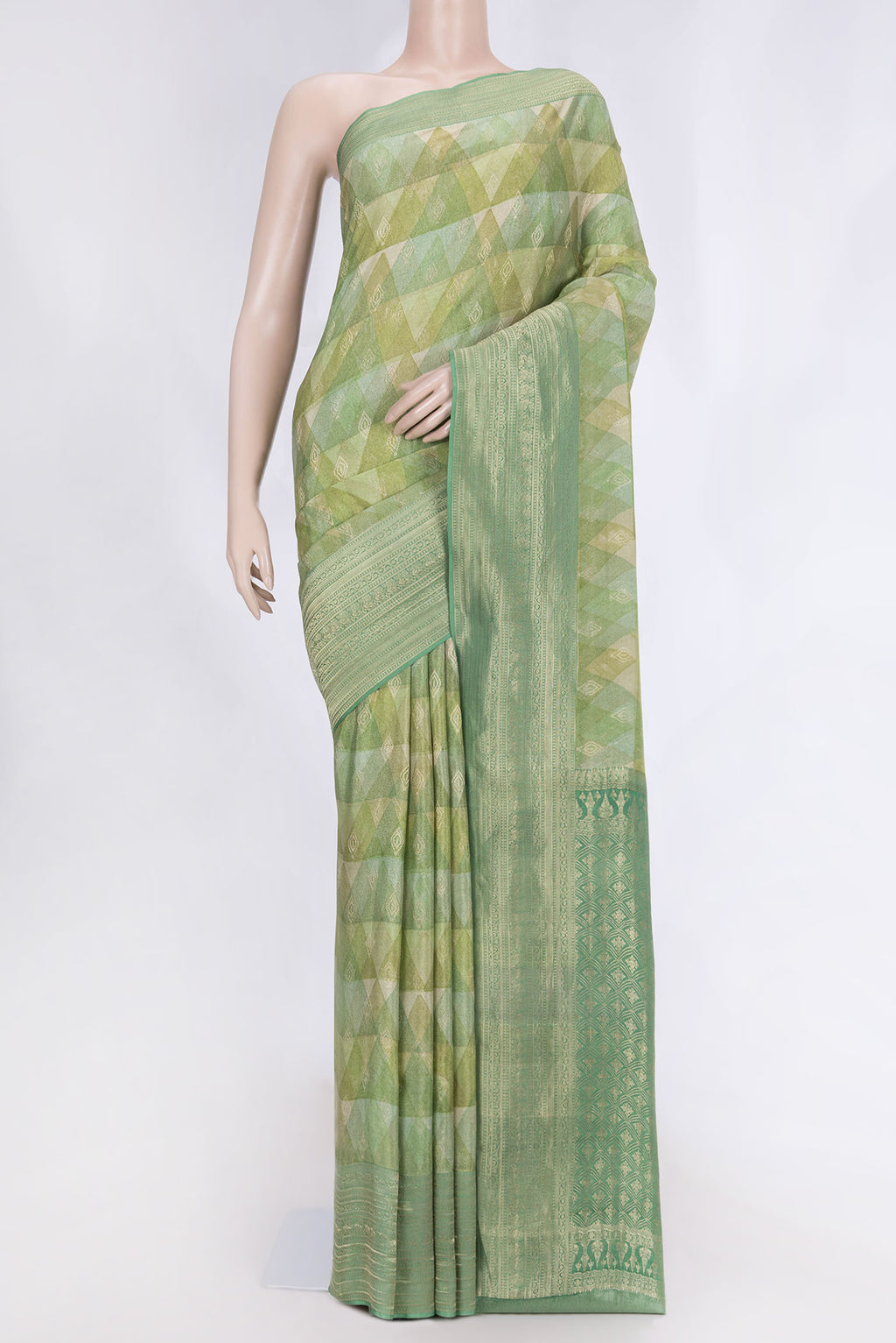 Green Dual Tone Mysore Crepe Saree with Printed design on the body and Zari Border displayed on a mannequin