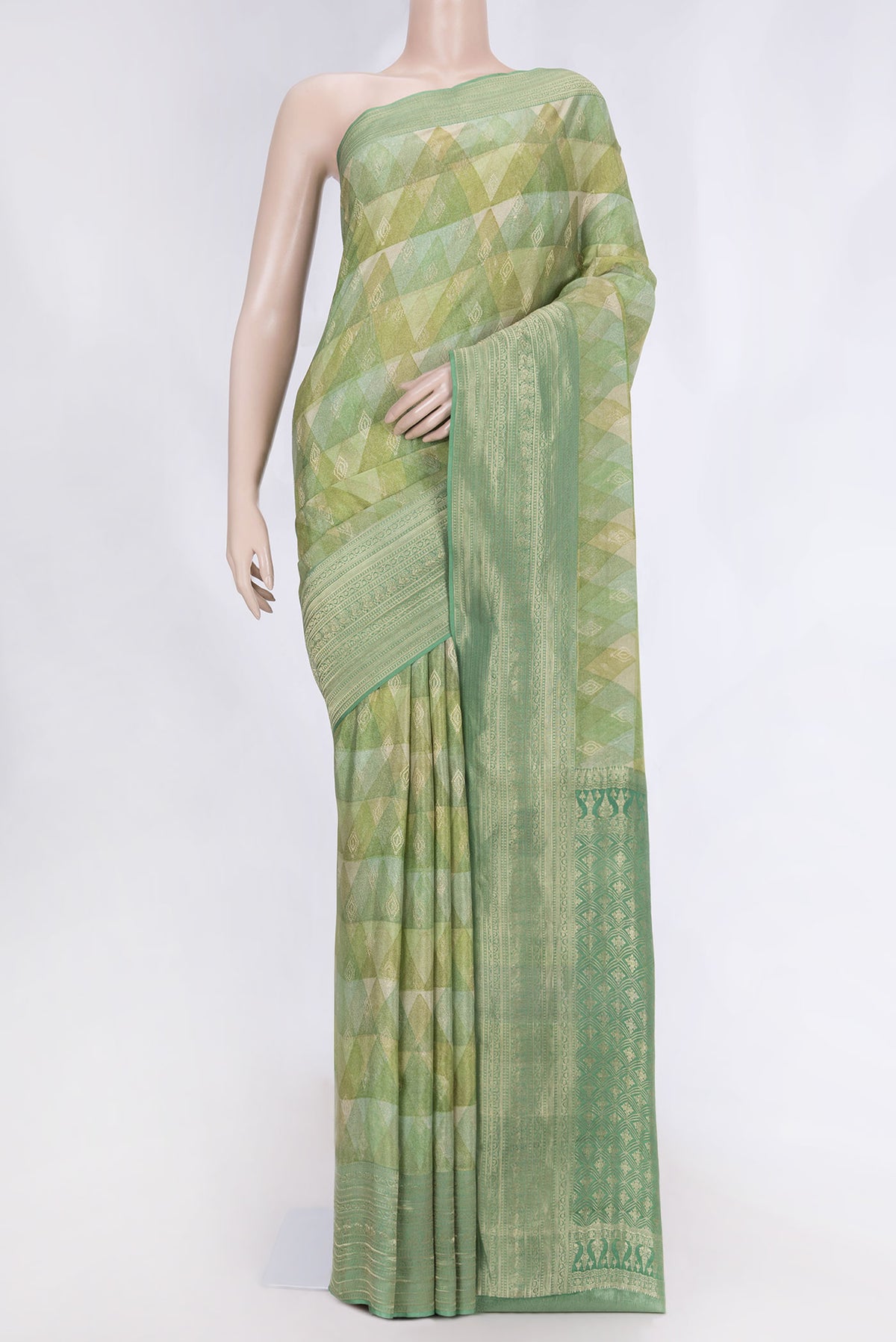 Green Dual Tone Mysore Crepe Saree with Printed design on the body and Zari Border displayed on a mannequin
