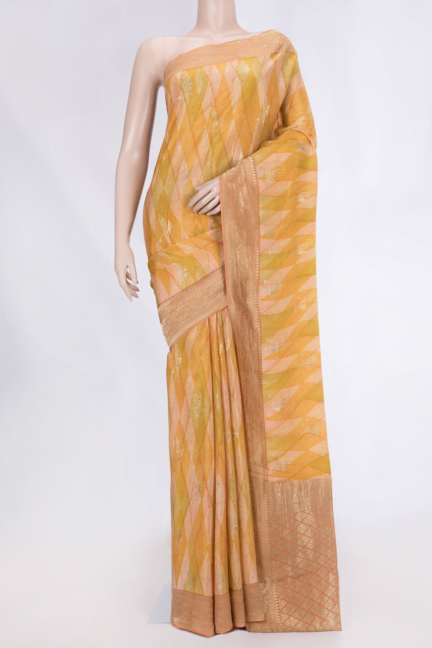 Mustard Dual Tone Mysore Georgette Saree with Printed design on the body and Zari Border displayed on a mannequin