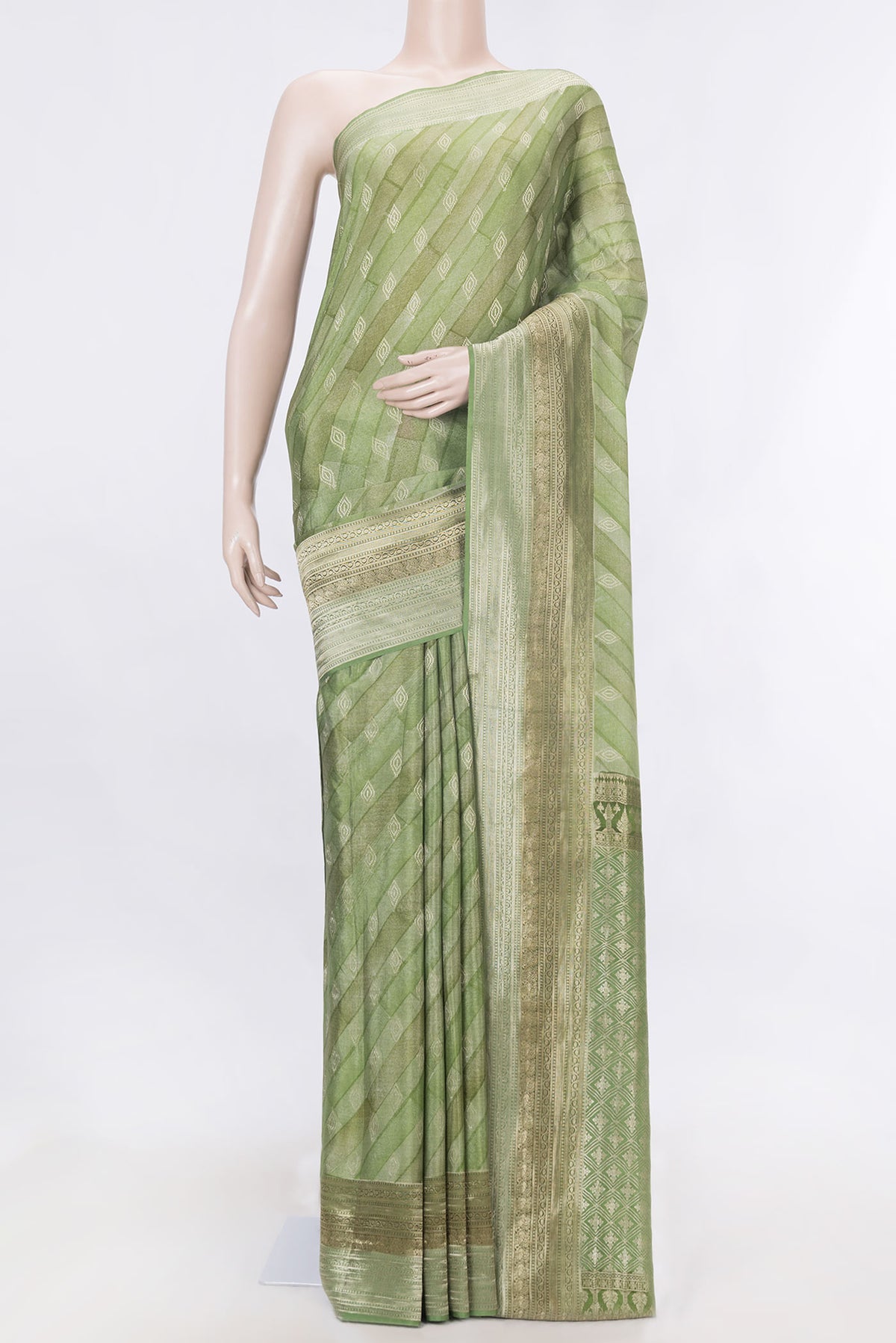 Green Dual Tone Mysore Georgette Saree With Printed design on the body and Zari Border displayed on a mannequin