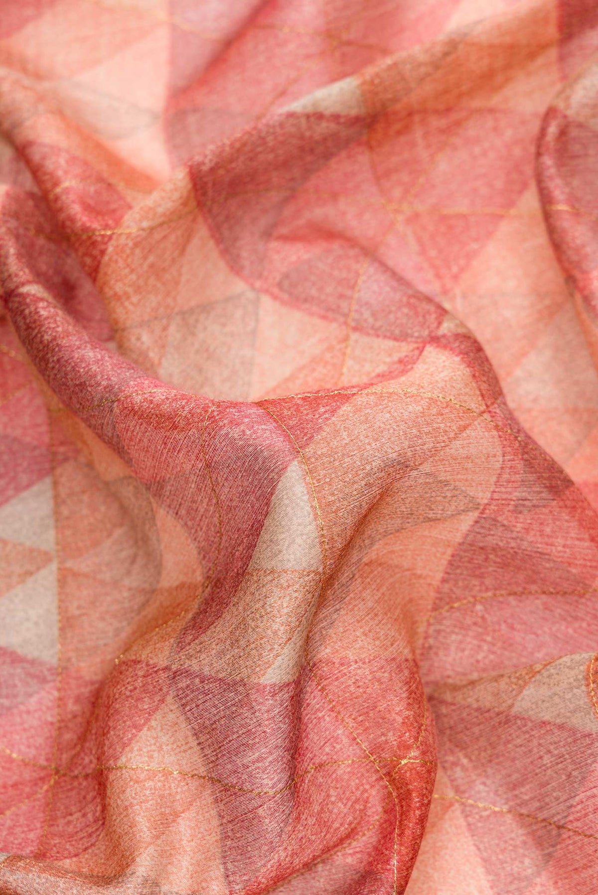 Close up of Pink Dual Tone Tussar Silk Saree with Printed design on the body and Zari Border.  displaying folds