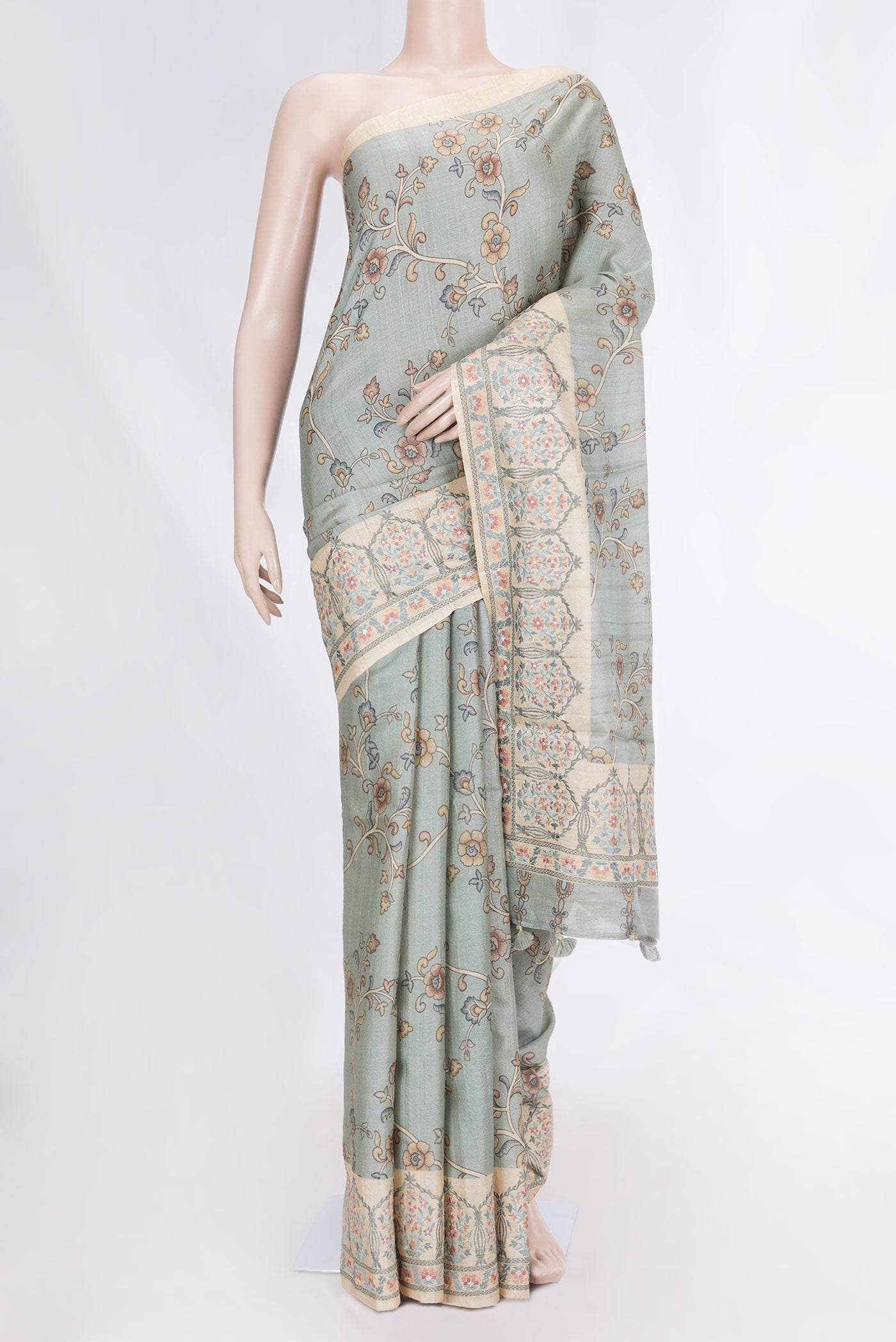 Grey Dual Tone Tussar Silk Saree with Printed design on the body and Embroidery Border displayed on a mannequin
