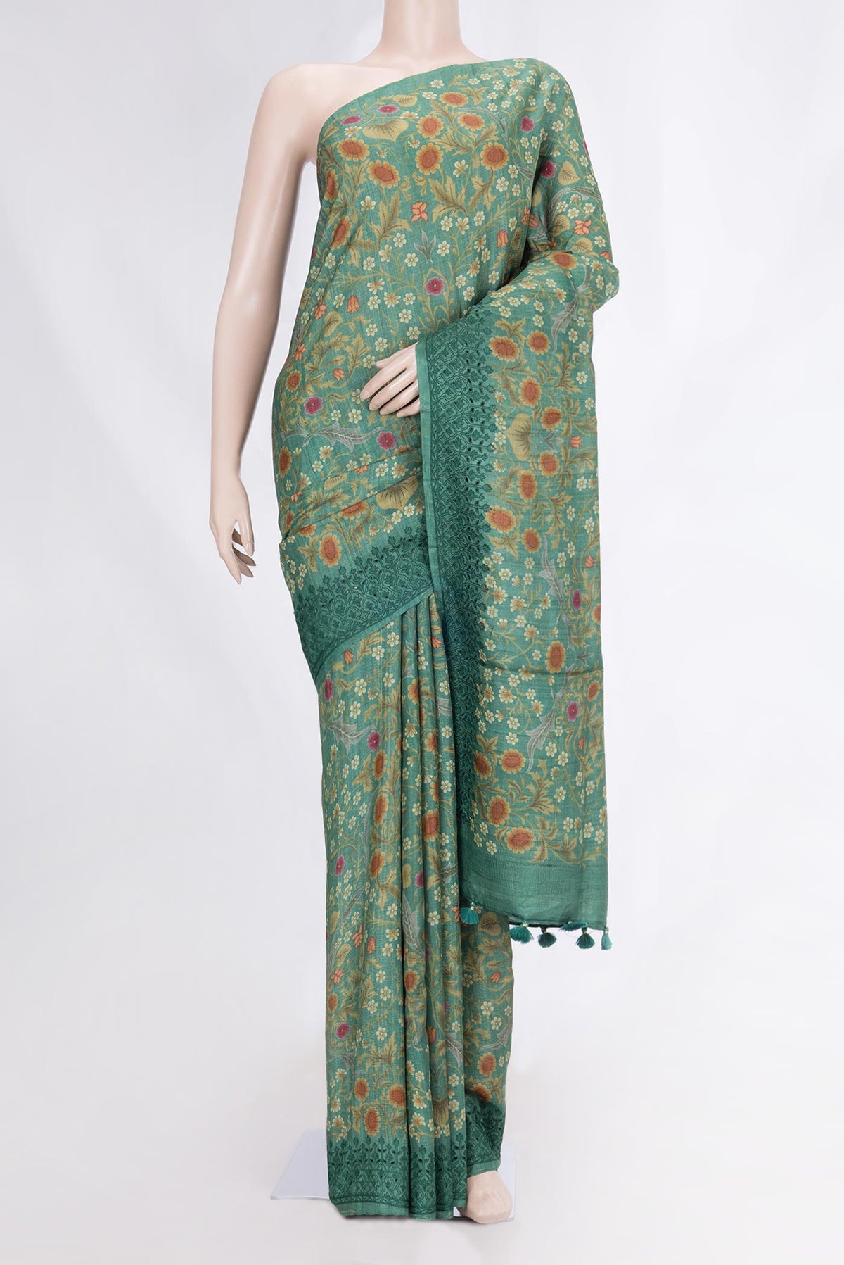 Green Dual Tone Tussar Silk Saree with Printed design on the body and Printed Border displayed on a mannequin