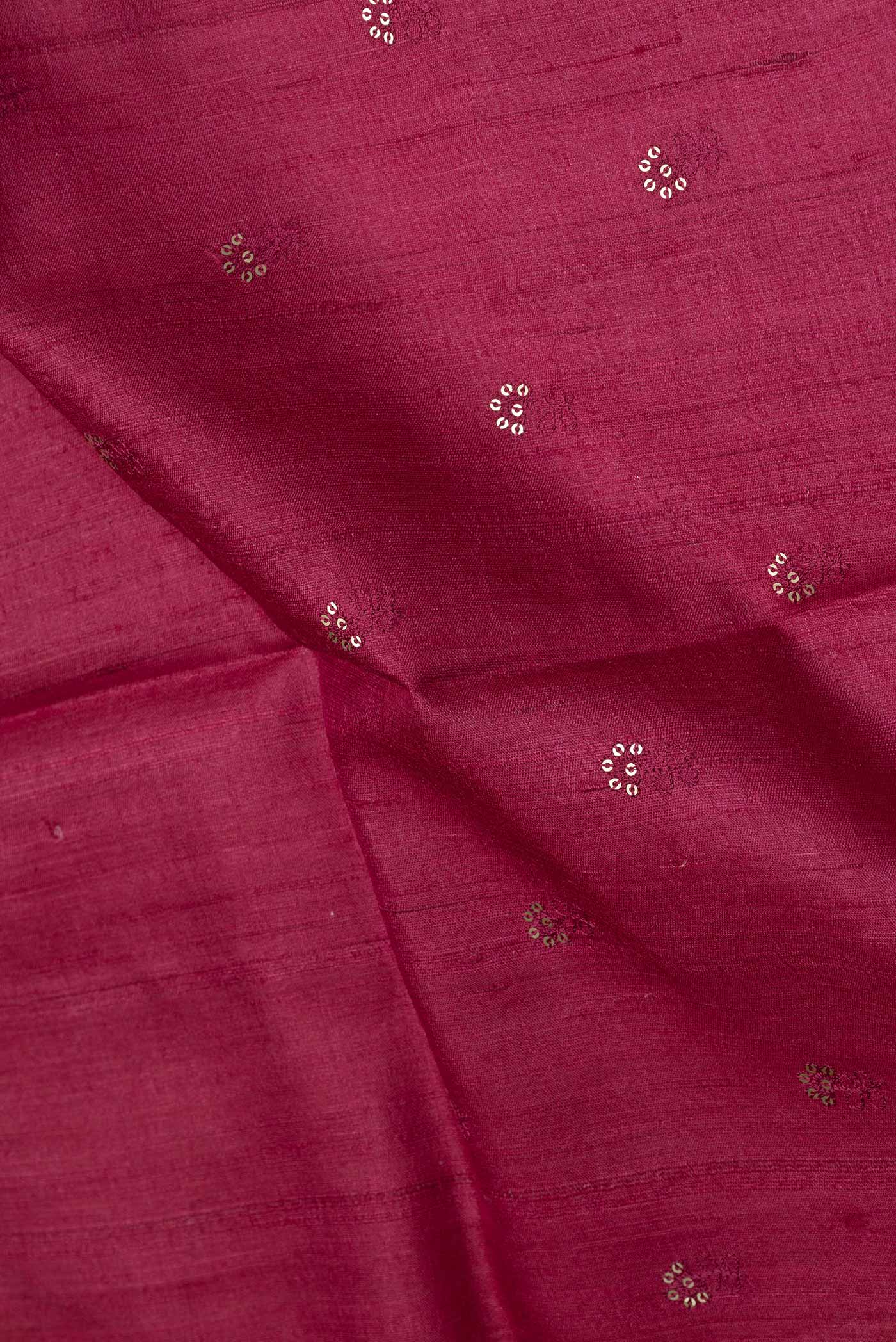 Close up of Maroon Dual Tone Tussar Silk Saree with Embroidery on the body and Plain Border displaying folds