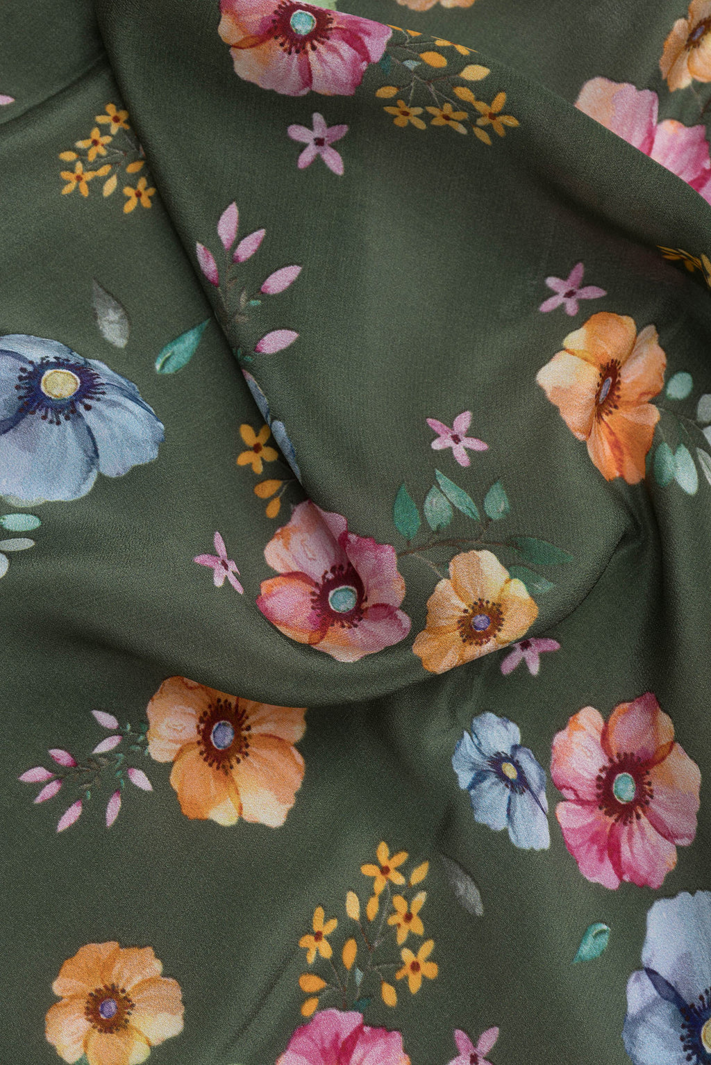 Close up of Olive Green Mysore Crepe Saree with Printed design on the body and Without Border.  displaying folds