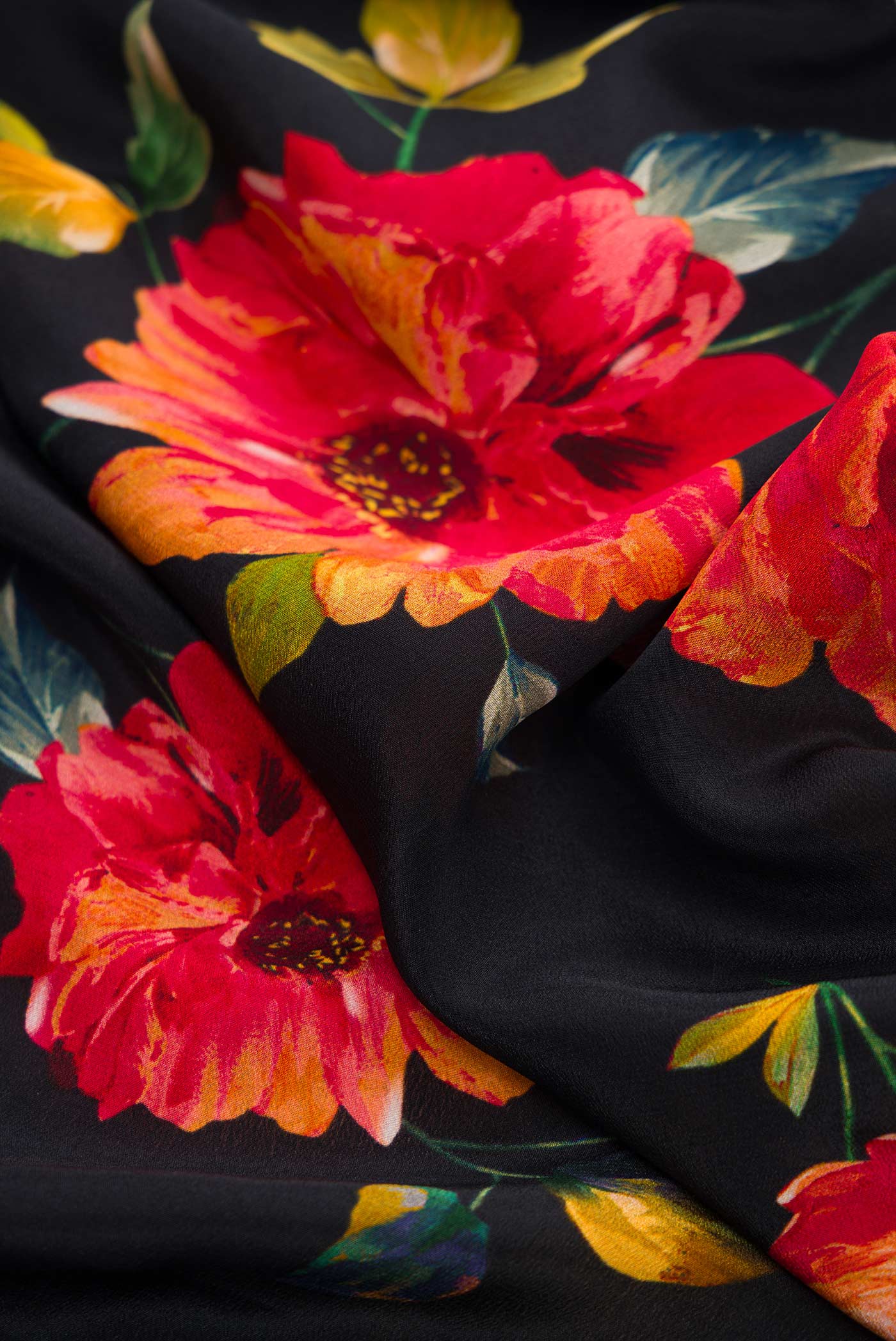 Close up of Black Dual Tone Mysore Crepe Saree with Printed design on the body and Without Border.  displaying folds