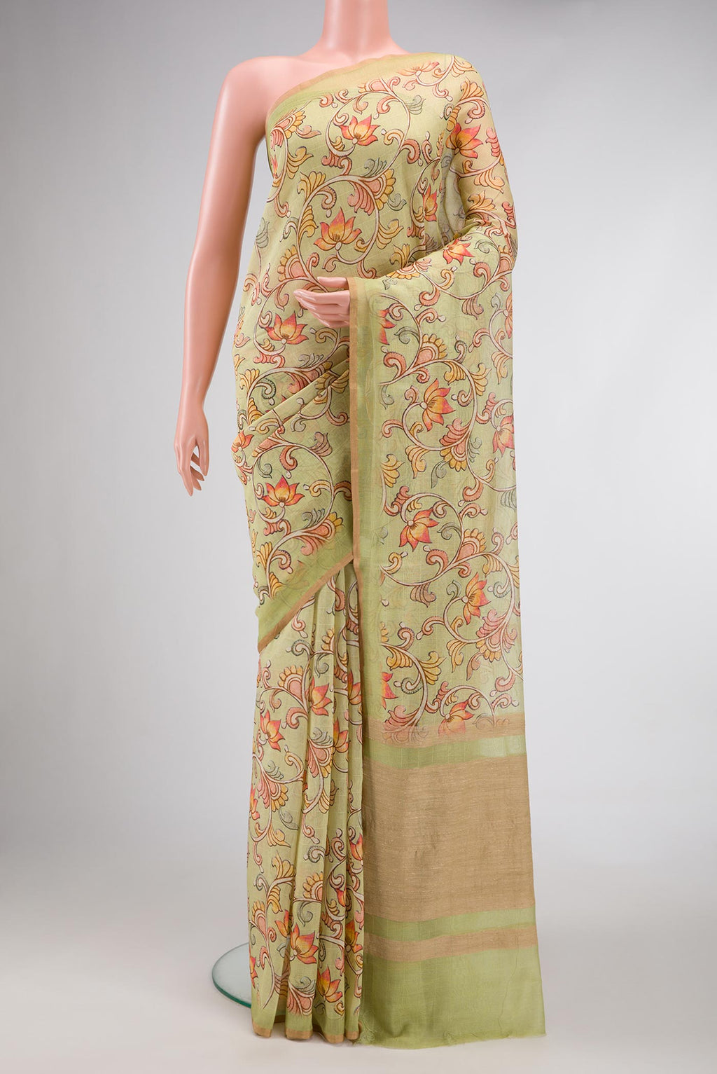 Pista Green Dual Tone Chanderi Silk Saree with kalamkari Print on the body and Zari Border.  displayed on a mannequin