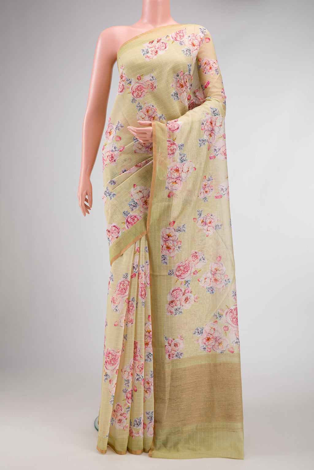 Pista Green Dual Tone Chanderi Silk Saree with Printed design on the body and Zari Border.  displayed on a mannequin