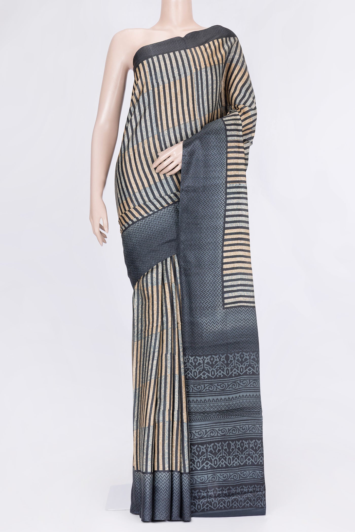 Black Dual Tone Tussar Silk Saree with Printed design on the body and Printed Border.  displayed on a mannequin