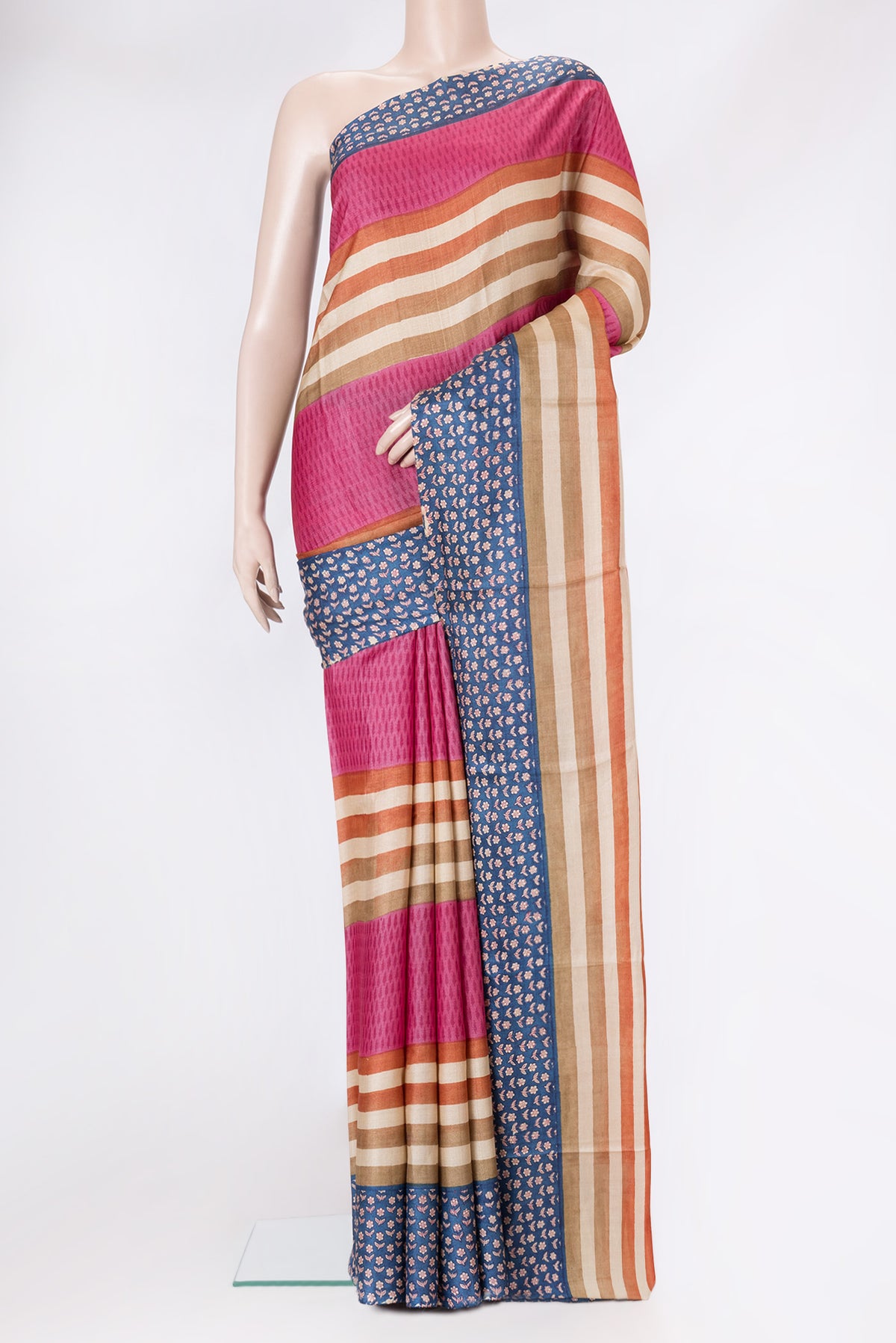 Pink Tussar Silk Saree with Stripes on the body and Printed Border.  displayed on a mannequin