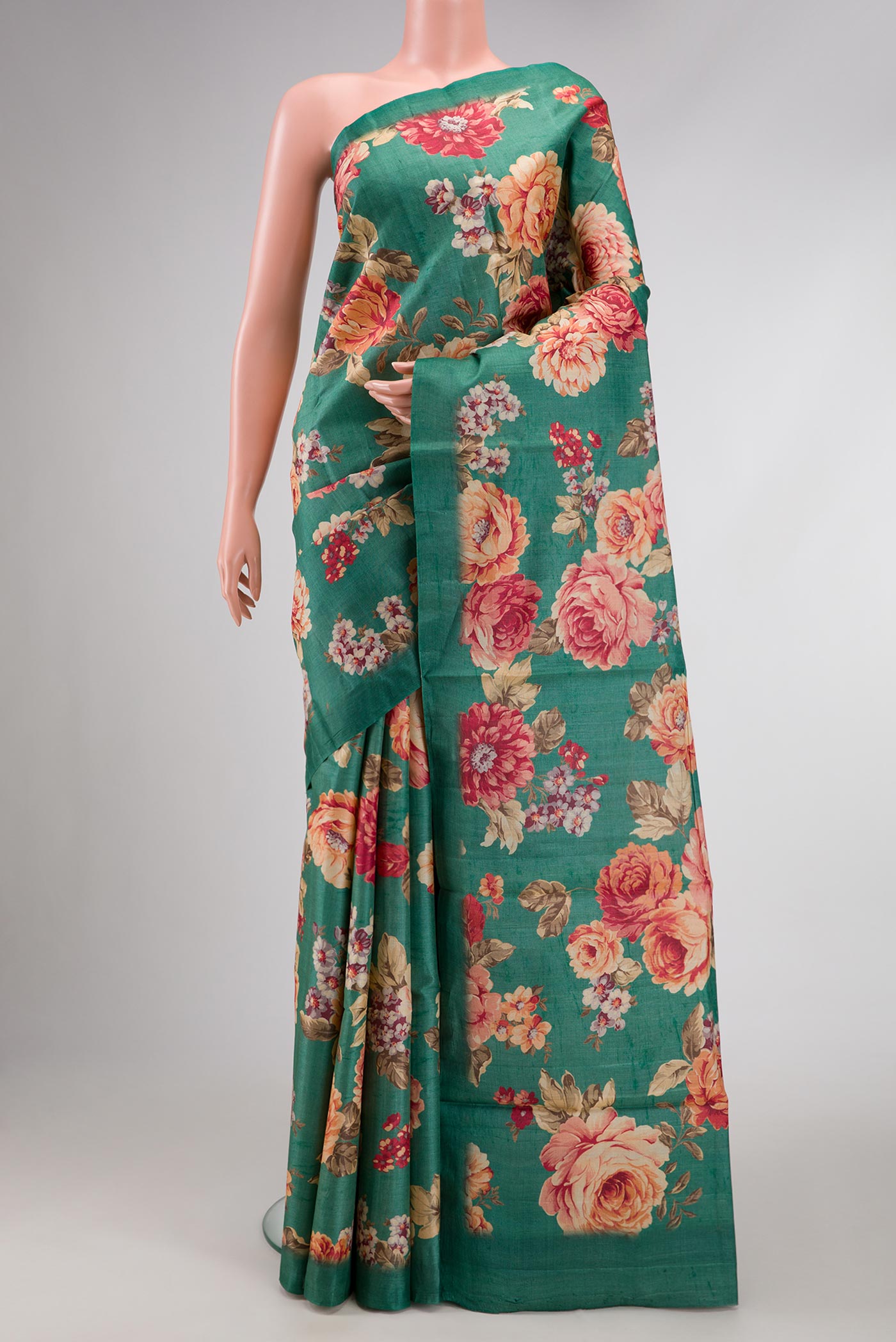 Green Dual Tone Tussar Silk Saree with Printed design on the body and Zari Border.  displayed on a mannequin