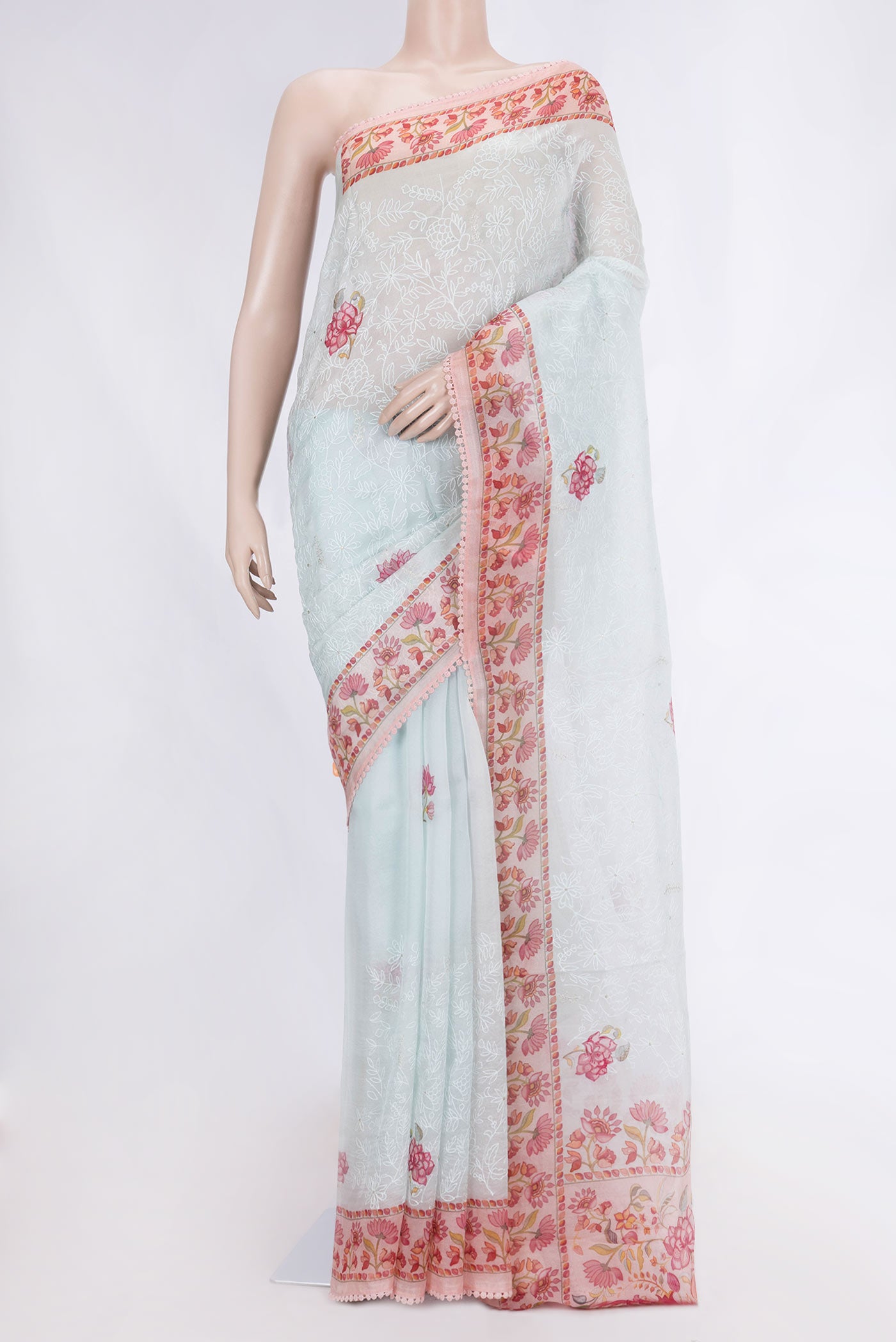 Light Blue Dual Tone Organza Silk Saree with Embroidery on the body and Embroidery Border displayed on a mannequin