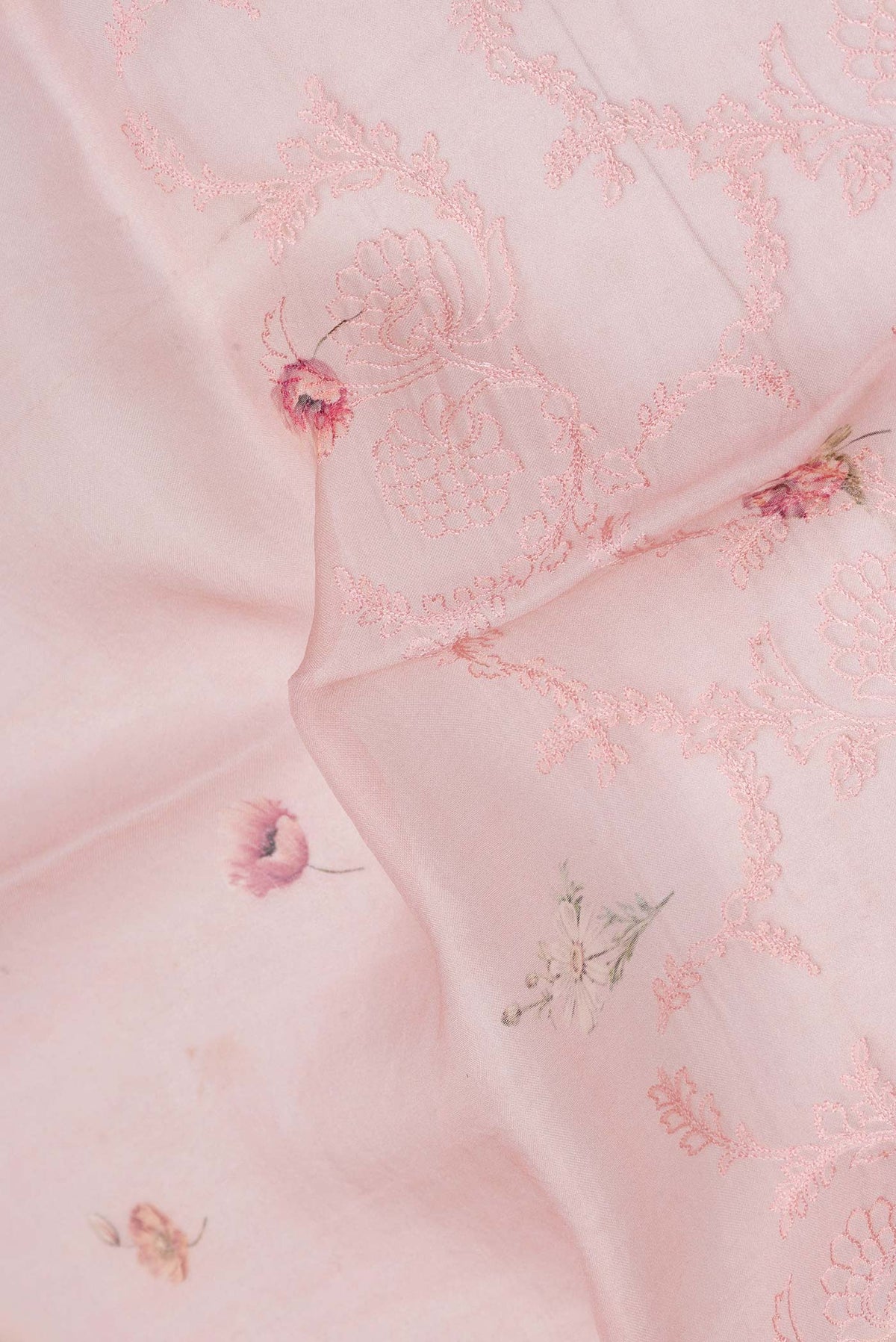 Close up of Pink Dual Tone Organza Silk Saree with Embroidery on the body and Embroidery Border displaying folds