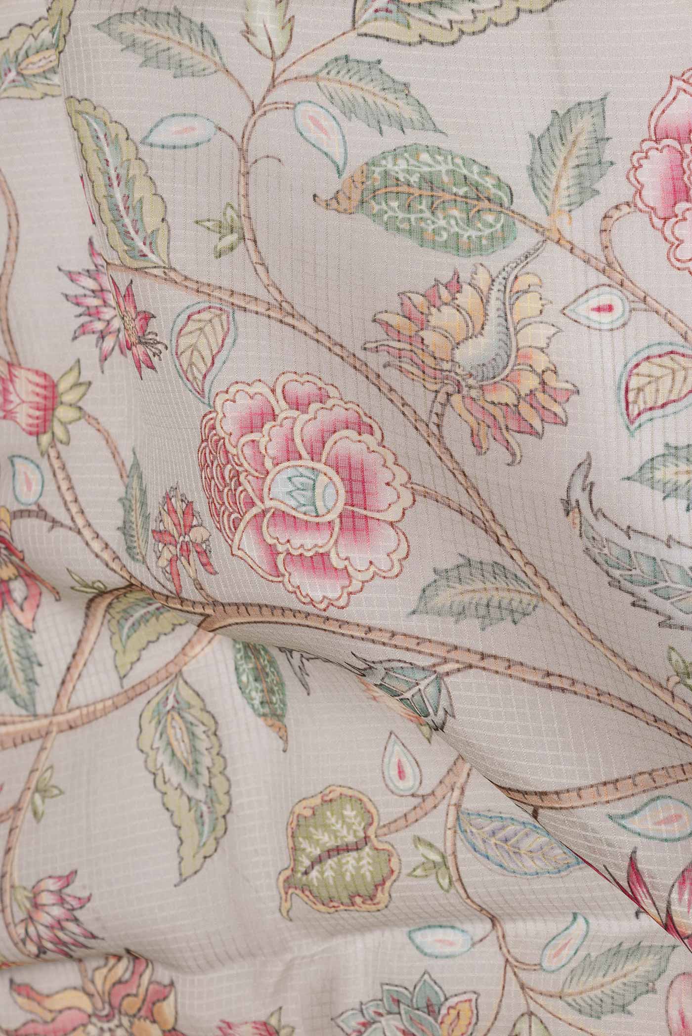 Close up of Grey Dual Tone Kota Silk Saree with Printed design on the body and Zari Border displaying folds