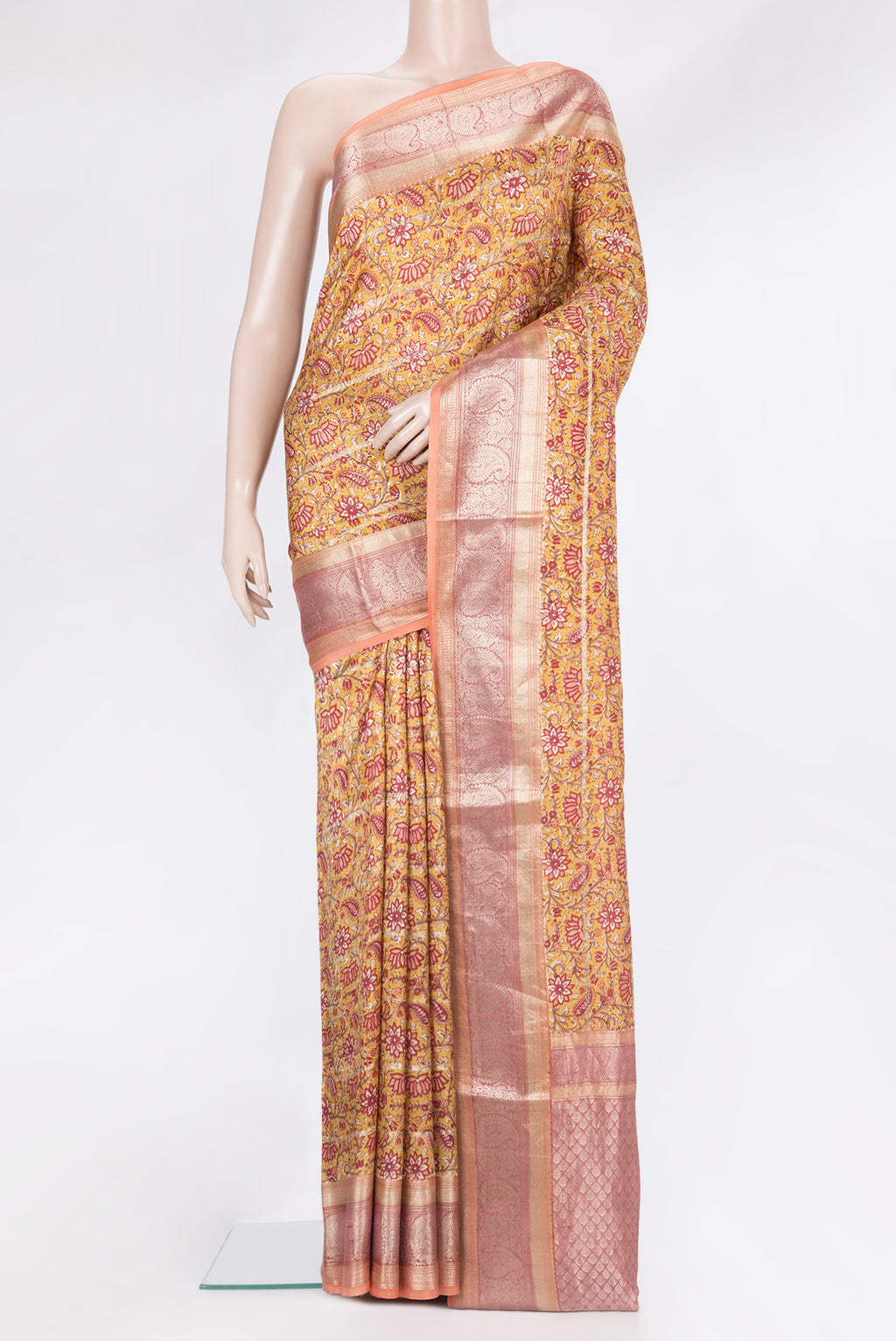 Pure Silk Mustard Kanchipuram Saree with Printed design on the body and Zari Border.  displayed on a mannequin