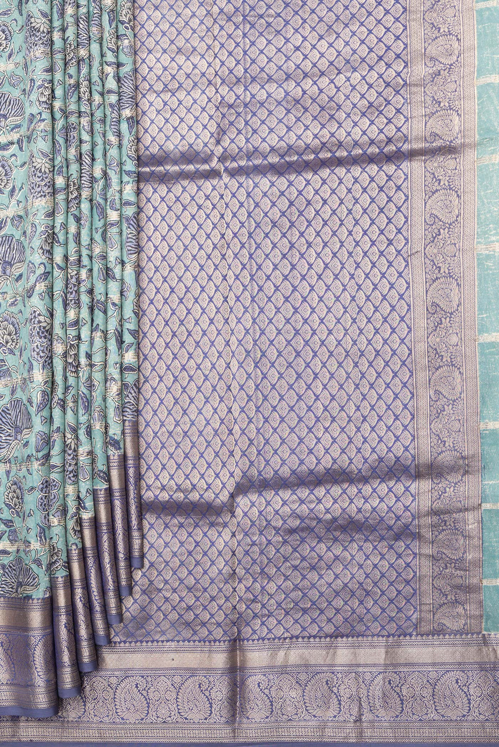 Pleats and pallu of Pure Silk Light Blue Kanchipuram Saree with Printed design on the body and Zari Border. 
