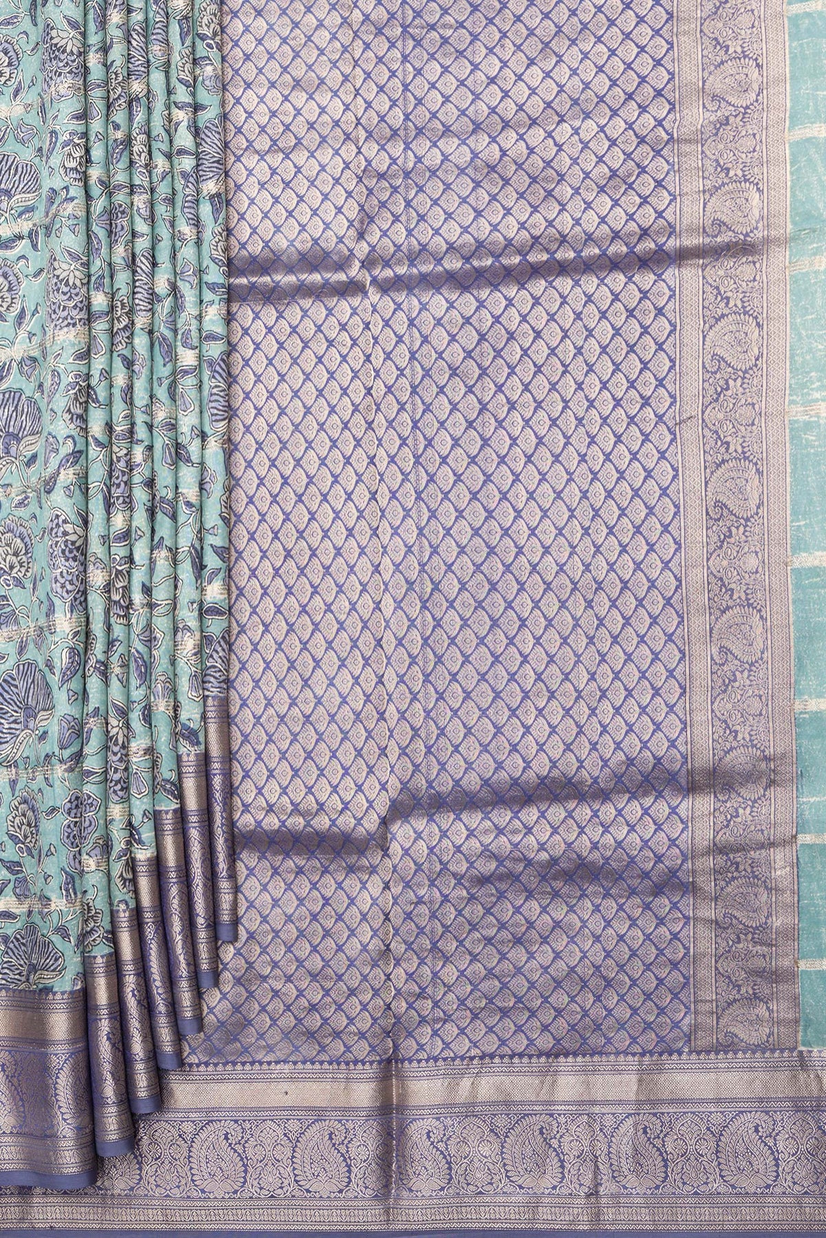 Pleats and pallu of Pure Silk Light Blue Kanchipuram Saree with Printed design on the body and Zari Border. 