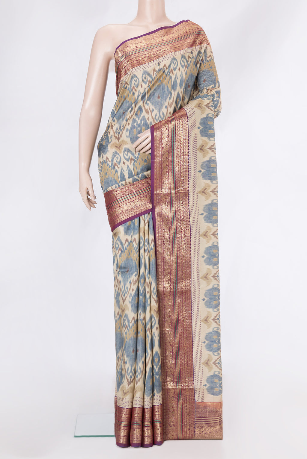 Dark Beige Dual Tone Kanchipuram Silk Saree with Ikat Print on the body and Zari Border.  displayed on a mannequin