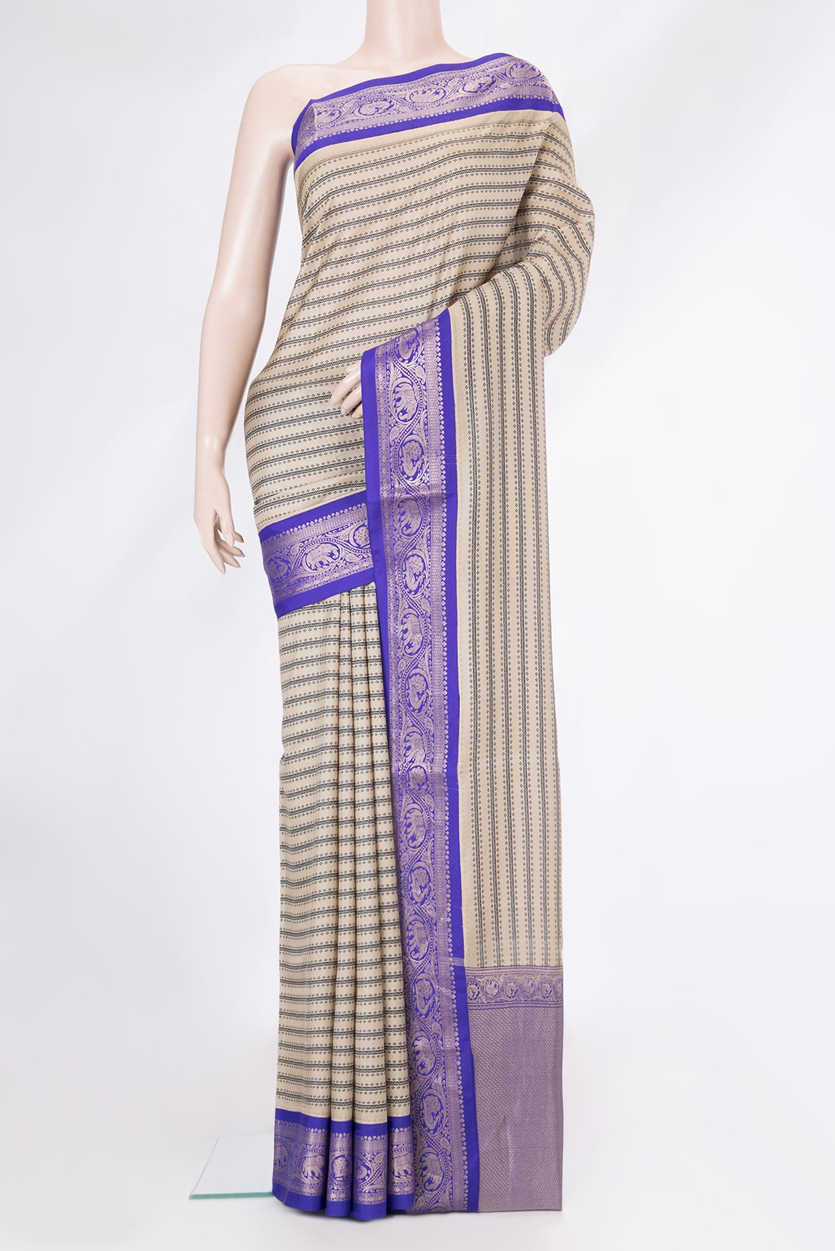 Beige Dual Tone Kanchipuram Silk Saree with Printed design on the body and Zari Border.  displayed on a mannequin
