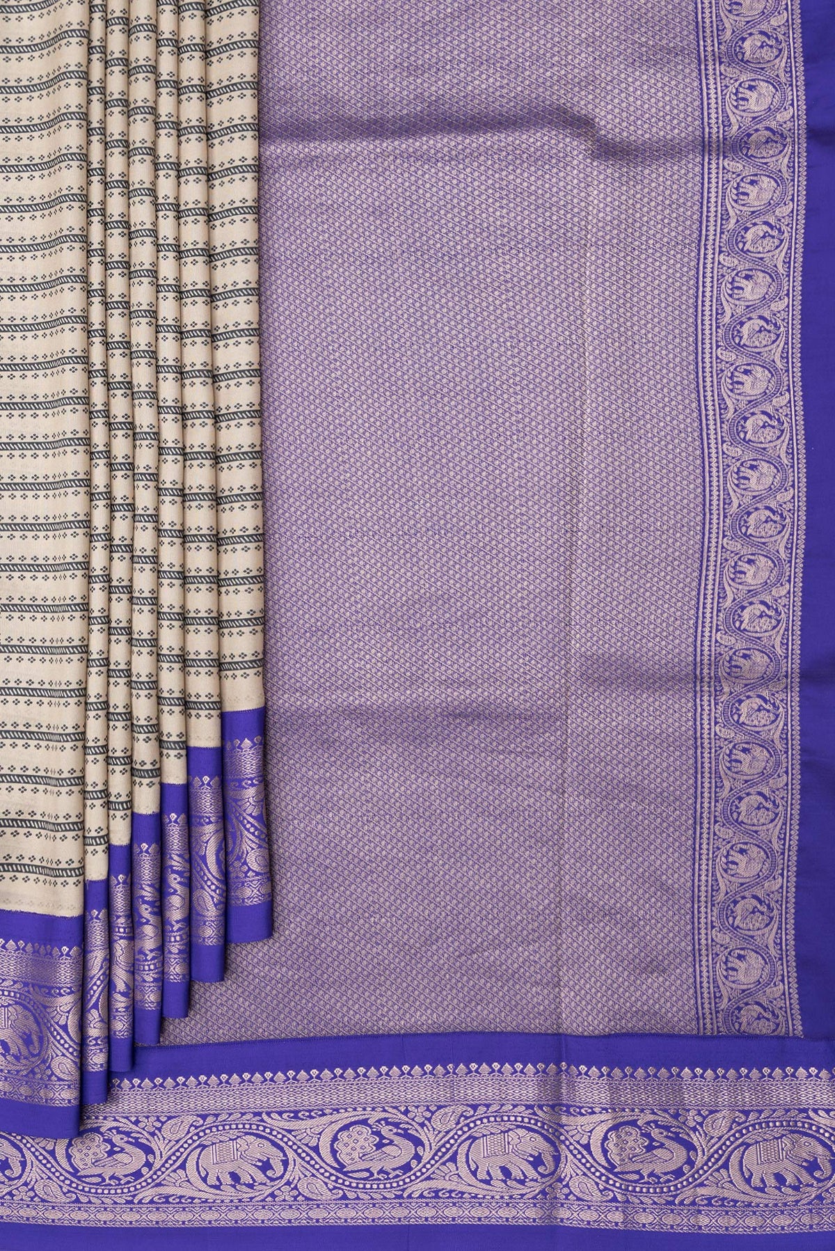 Pleats and pallu of Beige Dual Tone Kanchipuram Silk Saree with Printed design on the body and Zari Border. 