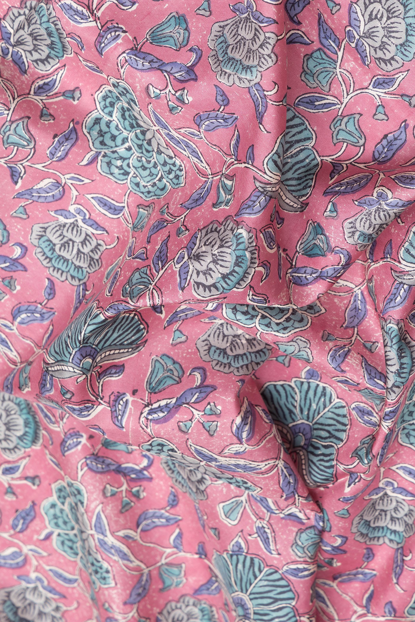 Close up of Pink Printed Silk Saree with Printed design on the body and Zari Border.  displaying folds