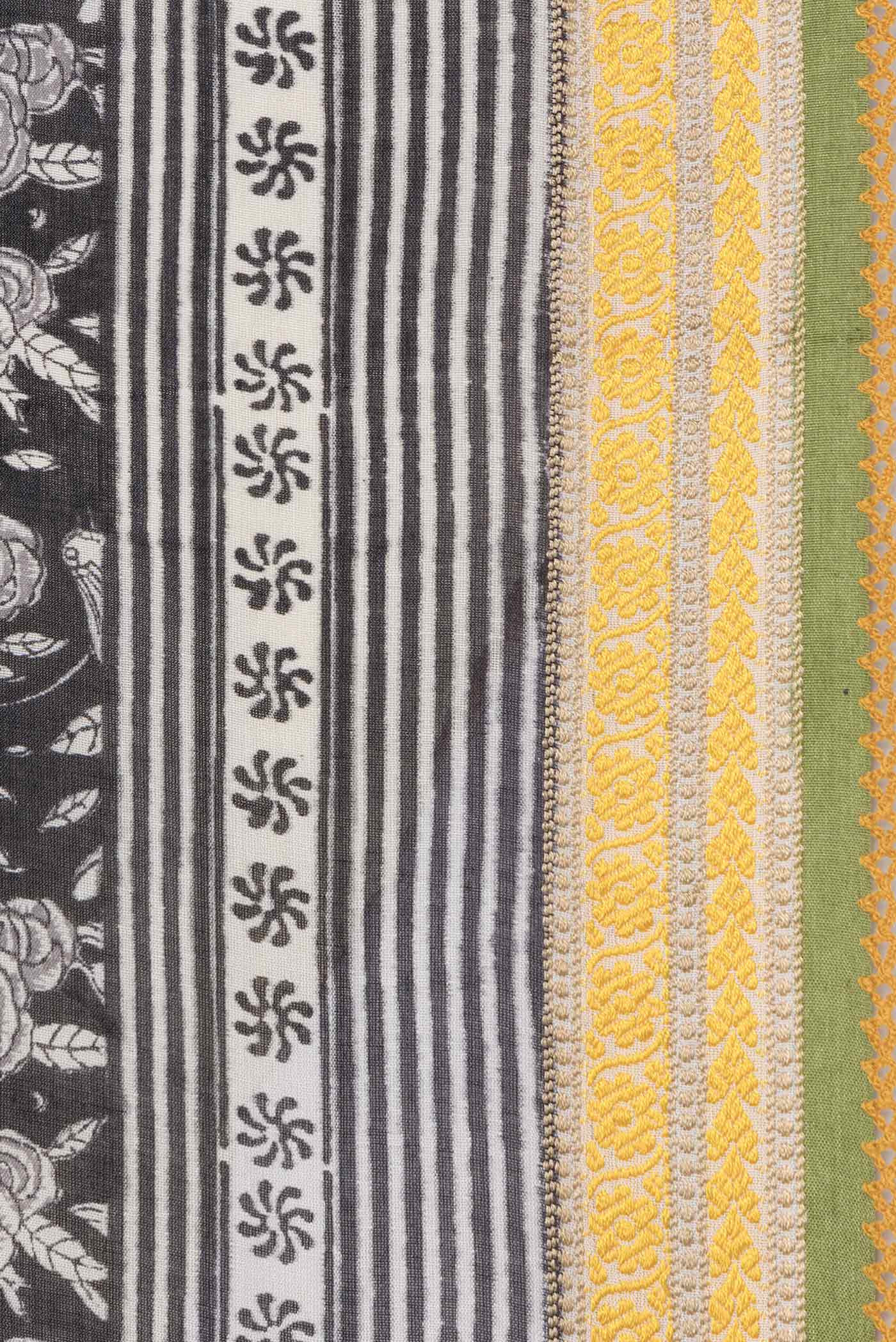 Border image of Black Dual Tone Tussar Silk Saree with Printed design on the body and Embroidery Border. 