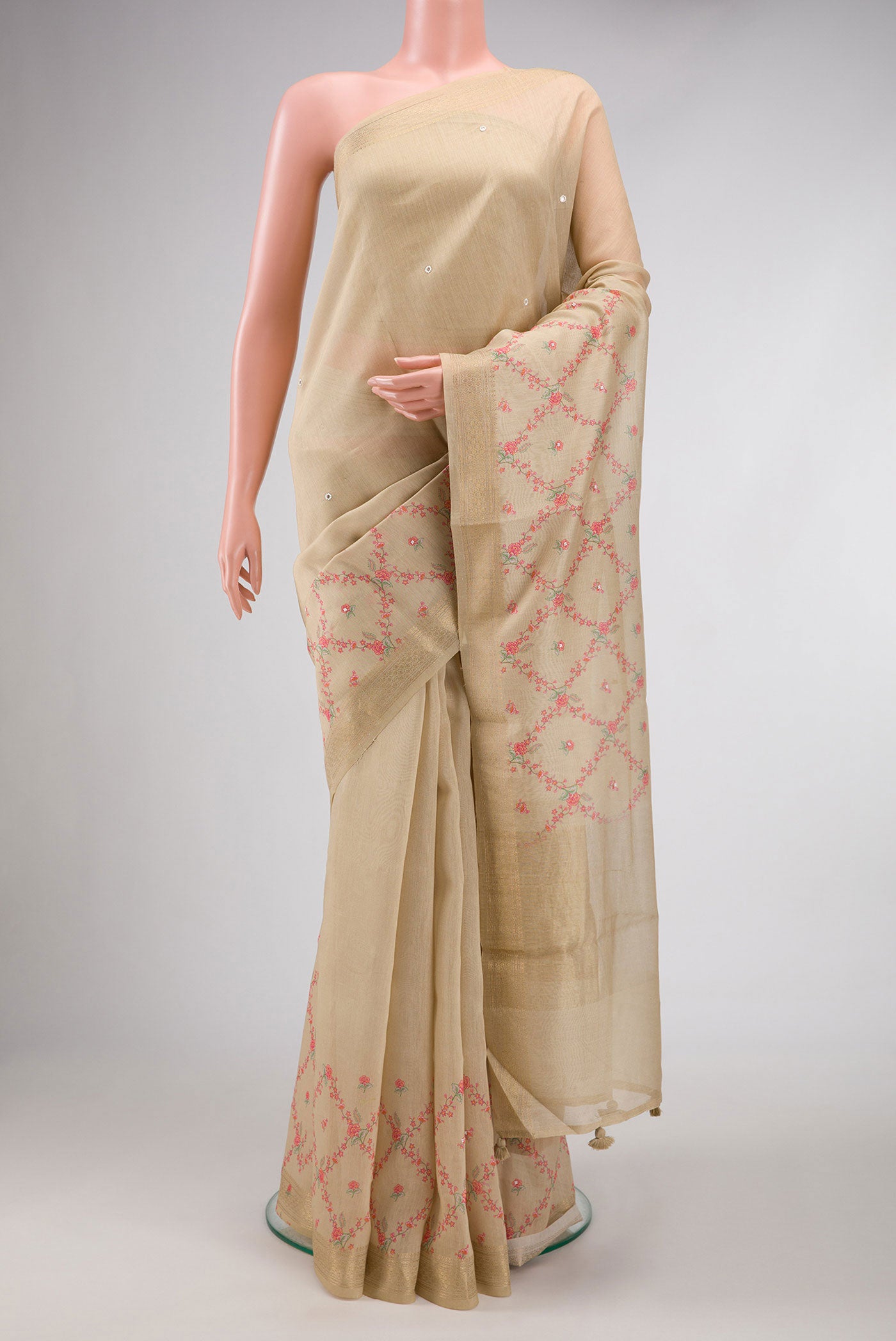 Beige Dual Tone Tussar Silk Saree with Embroidery on the body and Embroidery Border.  displayed on a mannequin