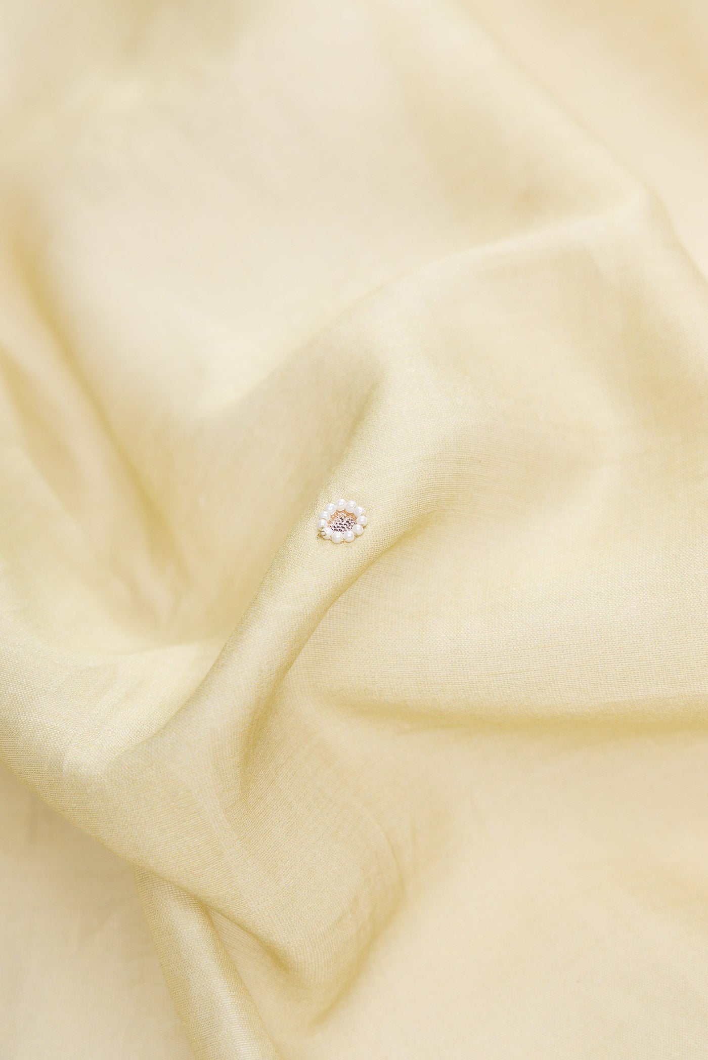 Close up of Pista Green Dual Tone Tussar Silk Saree with Printed design on the body and Zari Border.  displaying folds