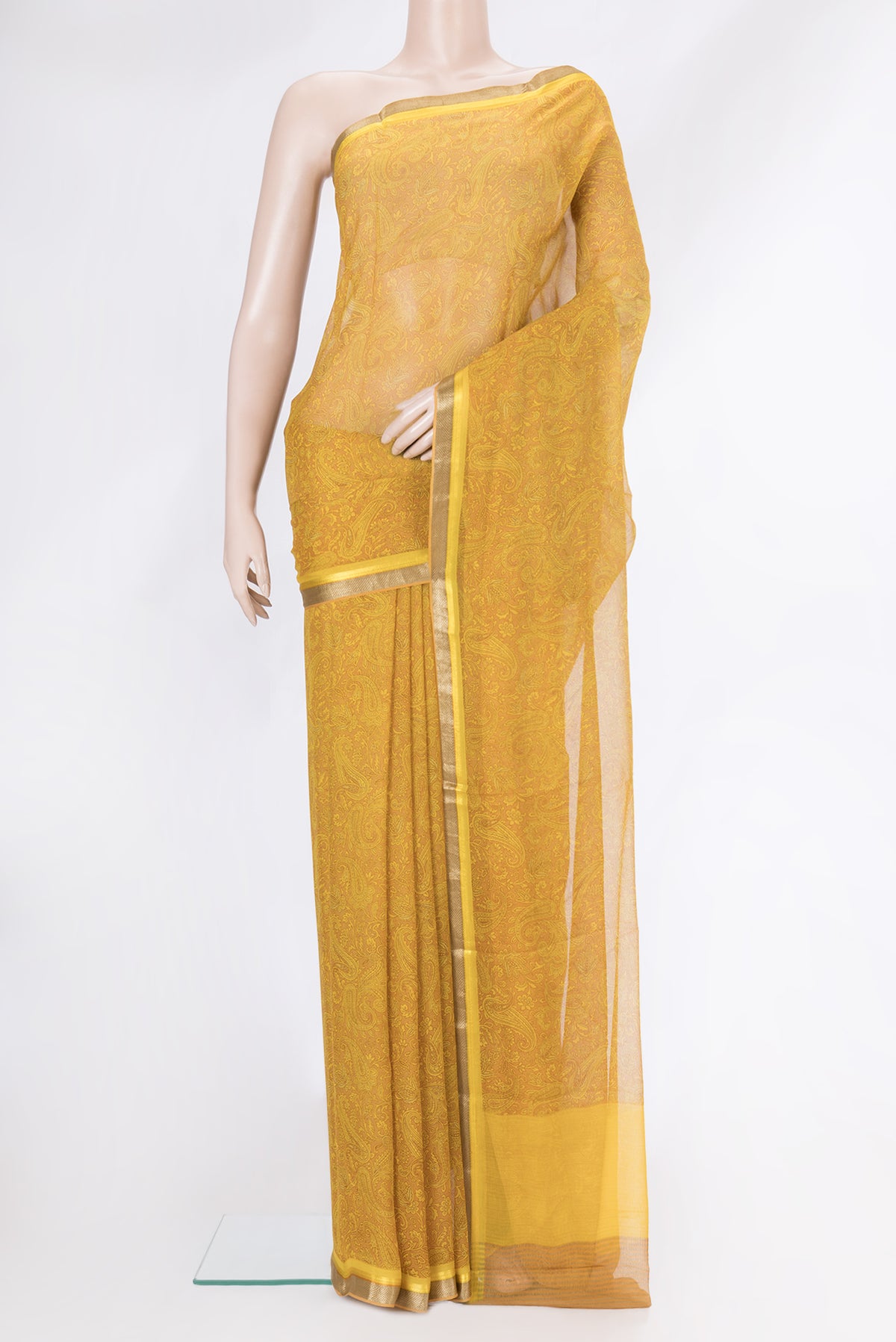 Mustard Dual Tone Mysore Chiffon Saree with Printed design on the body and Zari Border.  displayed on a mannequin