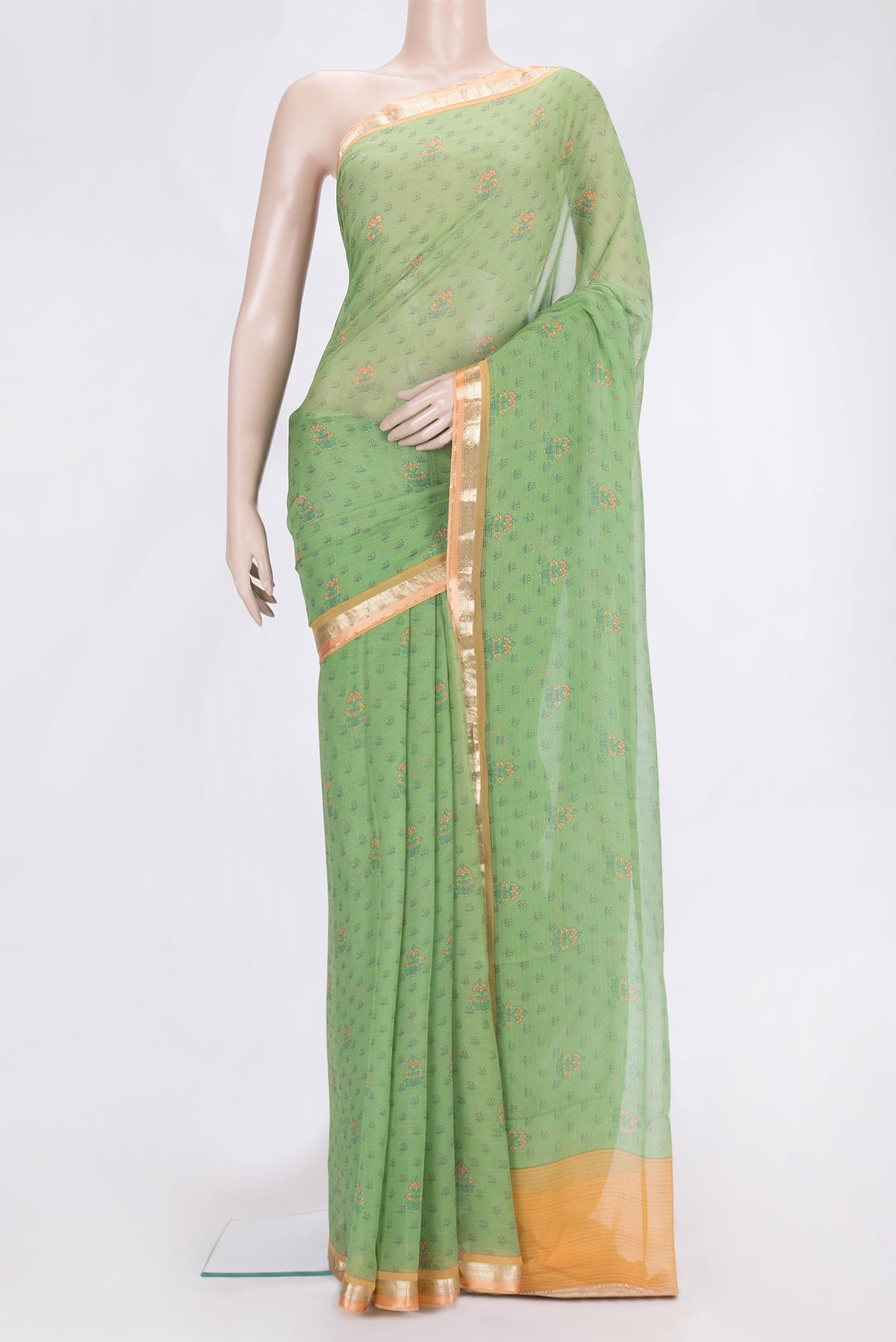 Green Dual Tone Mysore Chiffon Saree with Printed design on the body and Zari Border.  displayed on a mannequin