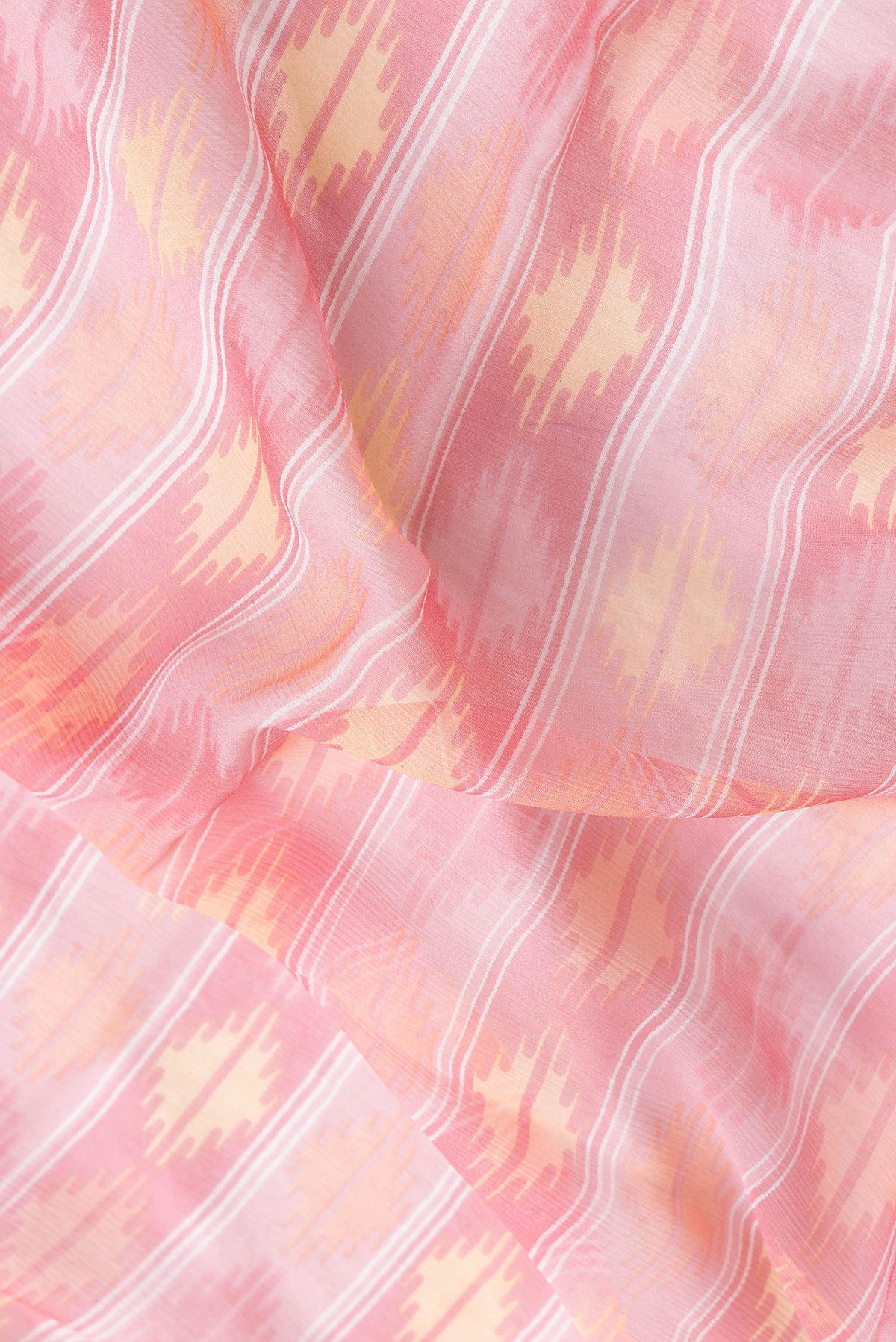 Close up of Pink Dual Tone Mysore Chiffon Saree with Printed design on the body and Zari Border.  displaying folds