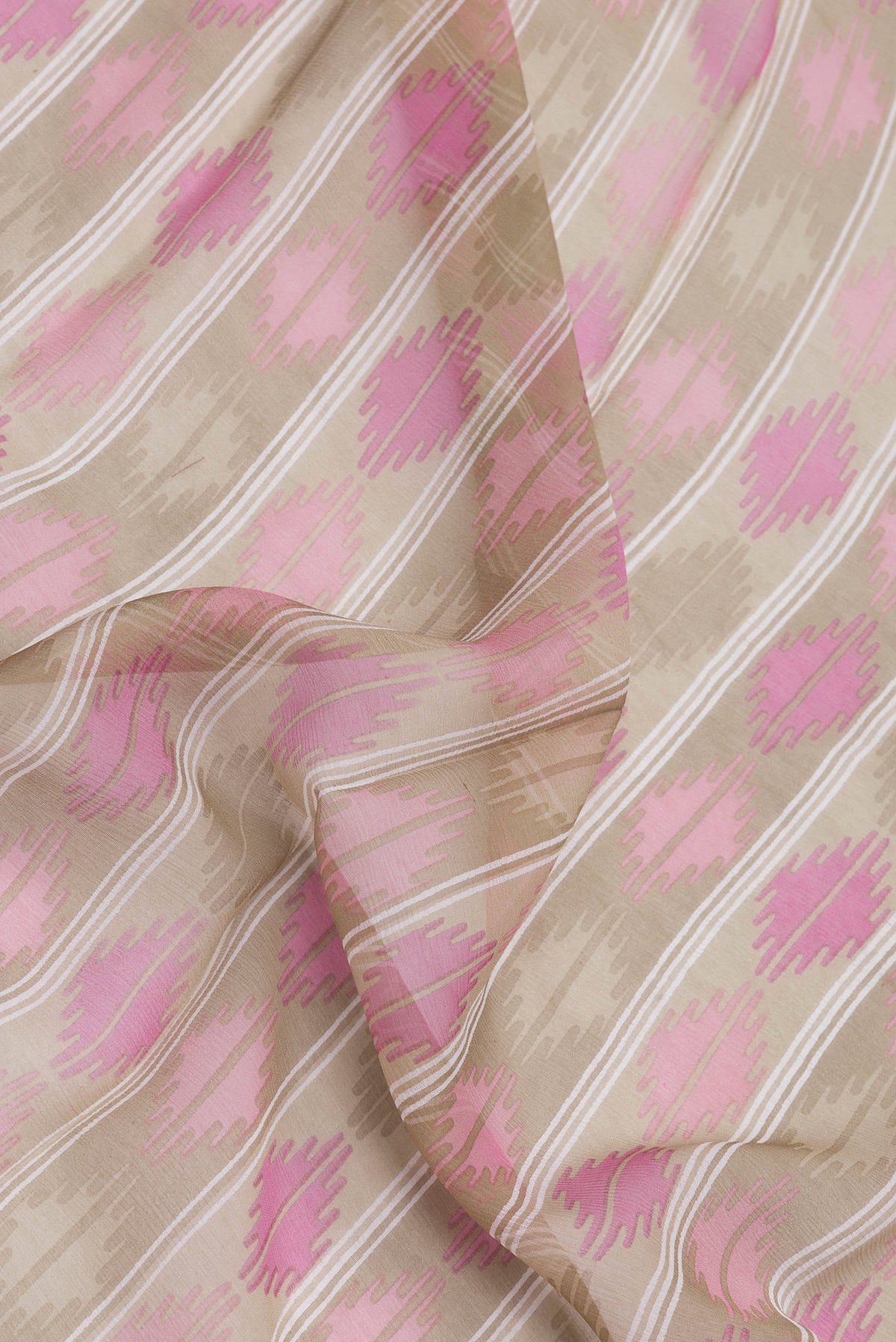 Close up of Brown Dual Tone Mysore Chiffon Saree with Printed design on the body and Zari Border.  displaying folds